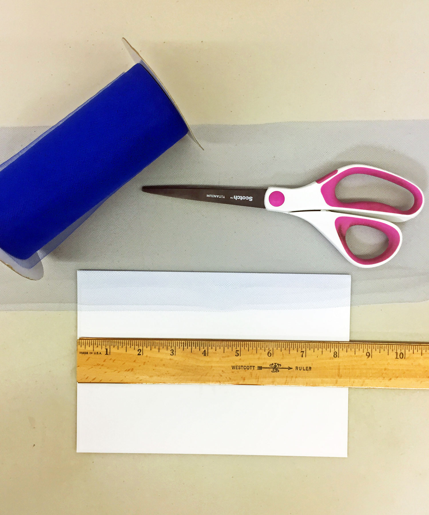 Step 1 is to cut a piece of ribbon that is 4 times the width of your envelope | OrnamentShop.com