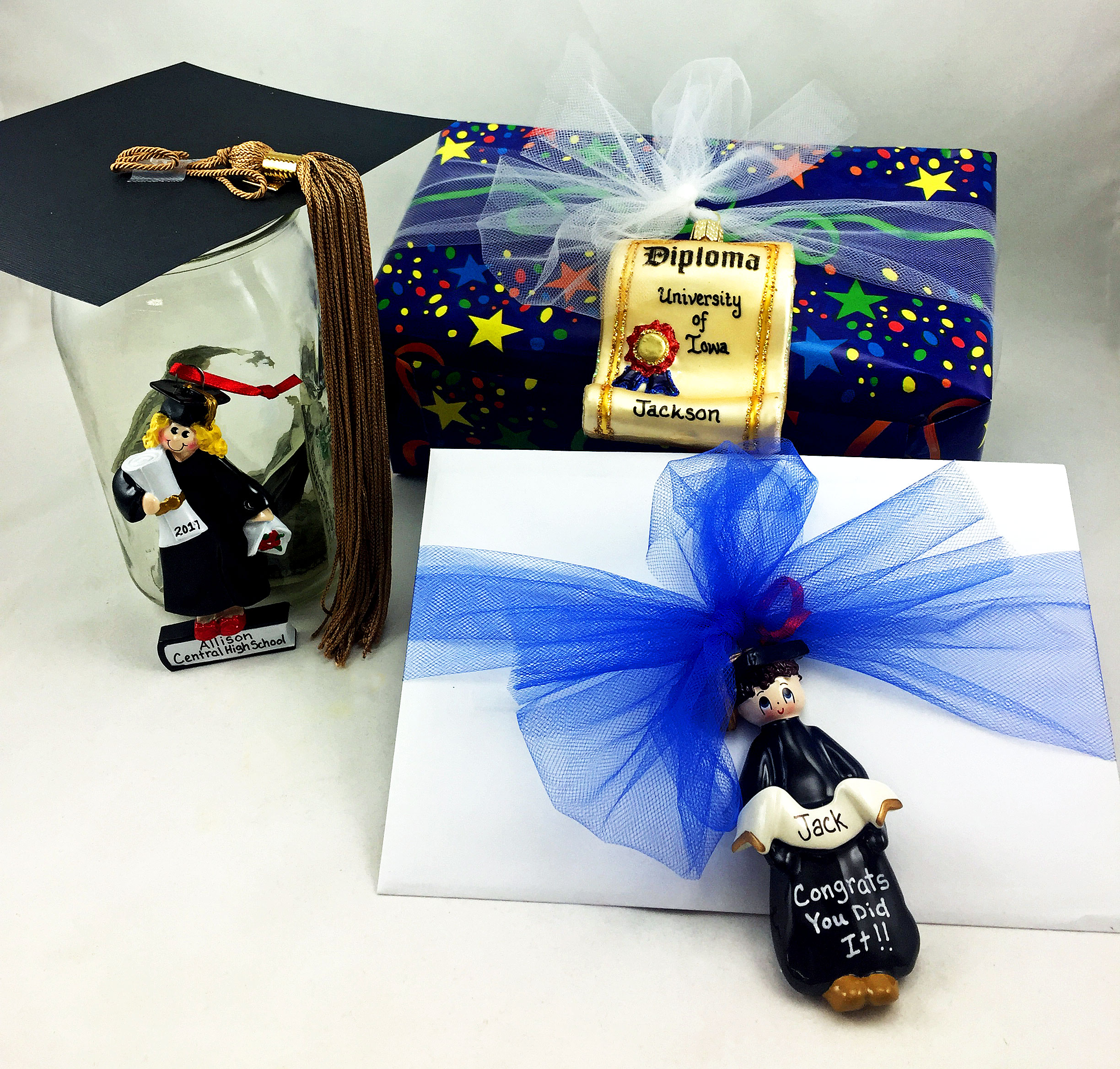 Three money gifts decorated with personalized graduation ornaments - one on an envelope, one on top of a box, one on a jar | OrnamentShop.com