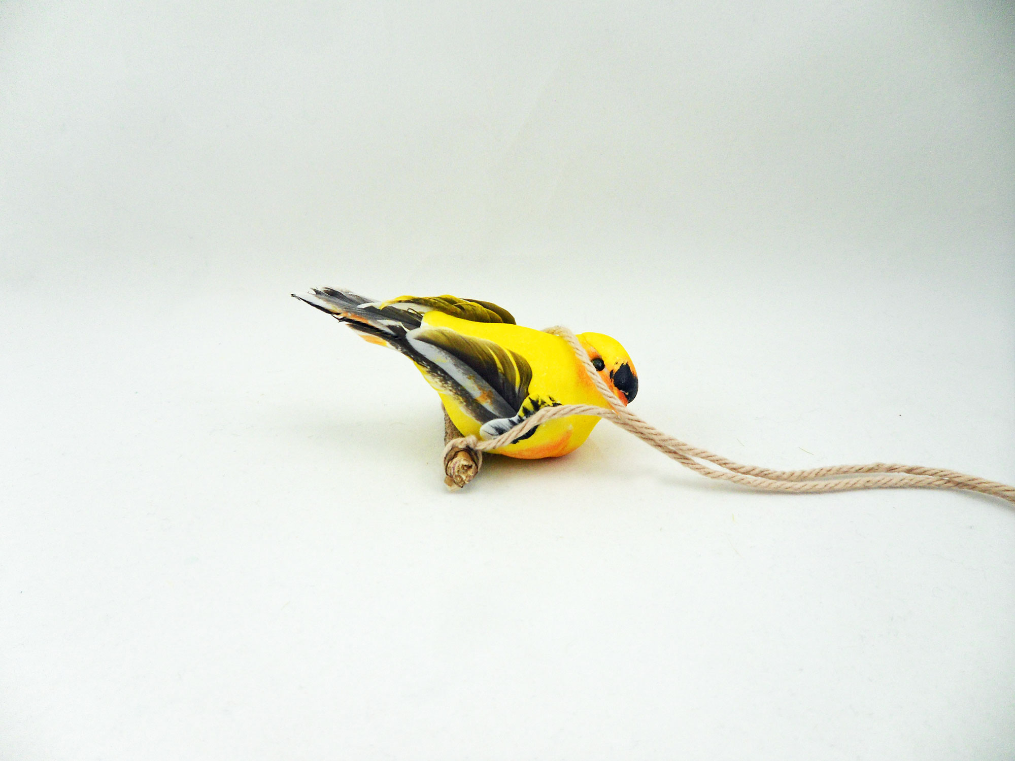 Step 6 is to glue the bird to the perch | OrnamentShop.com