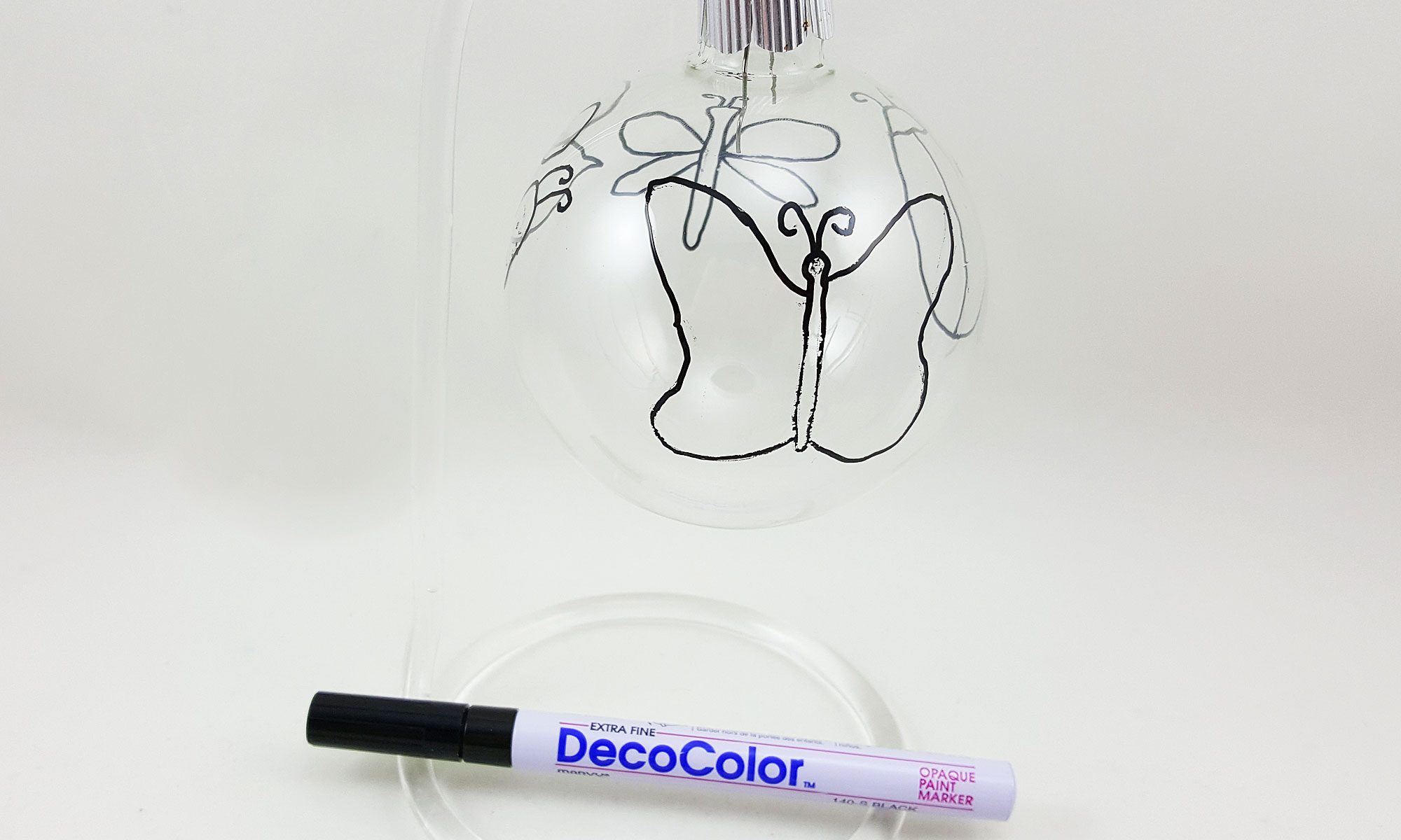 Step 1 is to outline your mosaic shapes on the clear class ball ornament | OrnamentShop.com