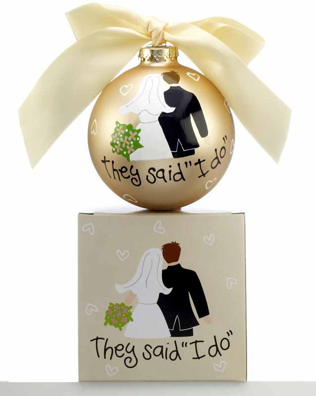 A wedding ornament that comes with it's own gift box shows a bride and groom standing side-by-side from the back and says 'They said I Do!' | OrnamentShop.com
