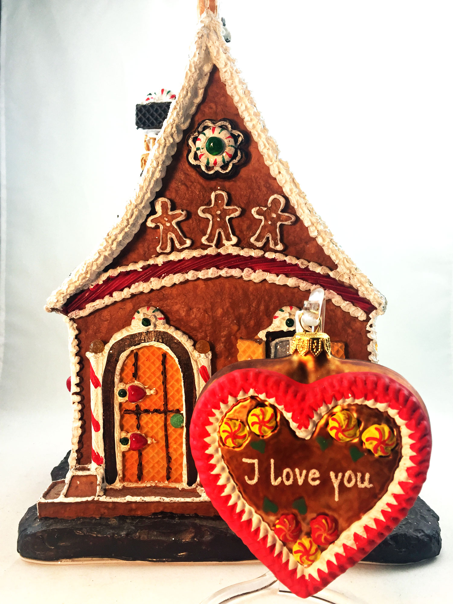 A gingerbread house decoration and a gingerbread cookie ornament that says I love you | OrnamentShop.com