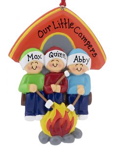 An ornament with 3 poeple sitting by a campfire roasting marshmallows in front of their tent. All can be personalized with names | OrnamentShop.com