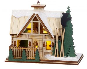 A three dimensional lodge or bed and breakfast ornament with pine trees and snow on the roof. The inside is customized with secret little scenes. | OrnamentShop.com