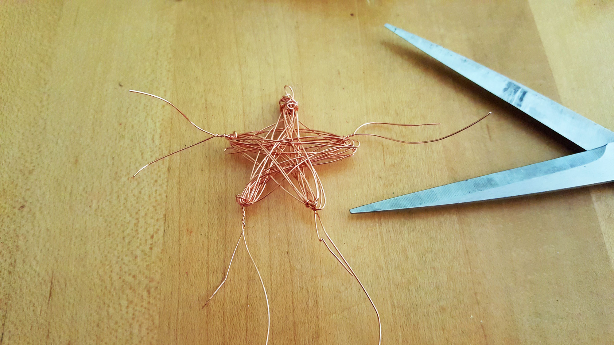 Step 4 is to remove the nails and slide the star off. Cut and twist the wire ends into the star | OrnamentShop.com