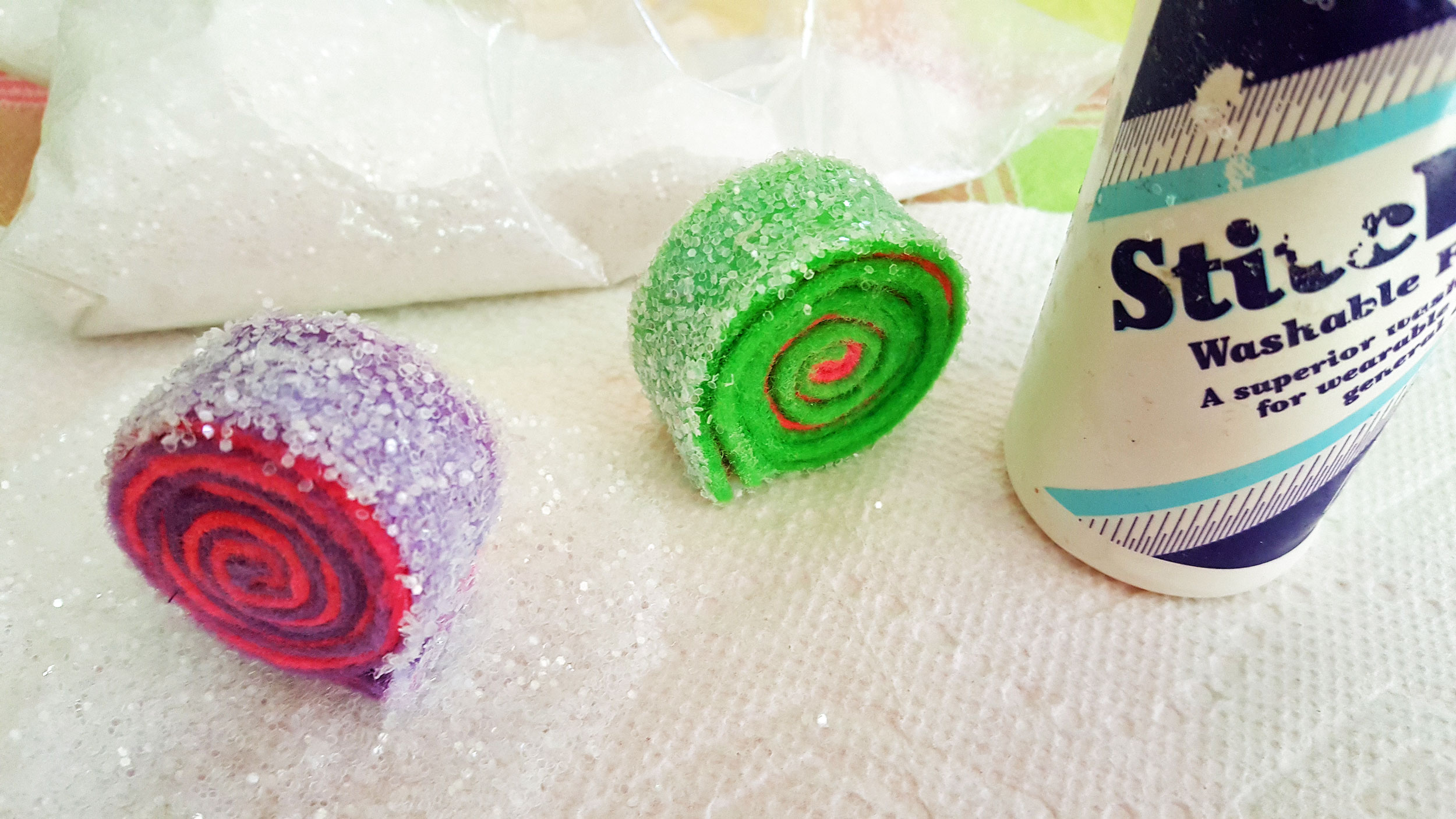 Step 5 is to roll the outside of the rolled felt in glitter. | OrnamentShop.com
