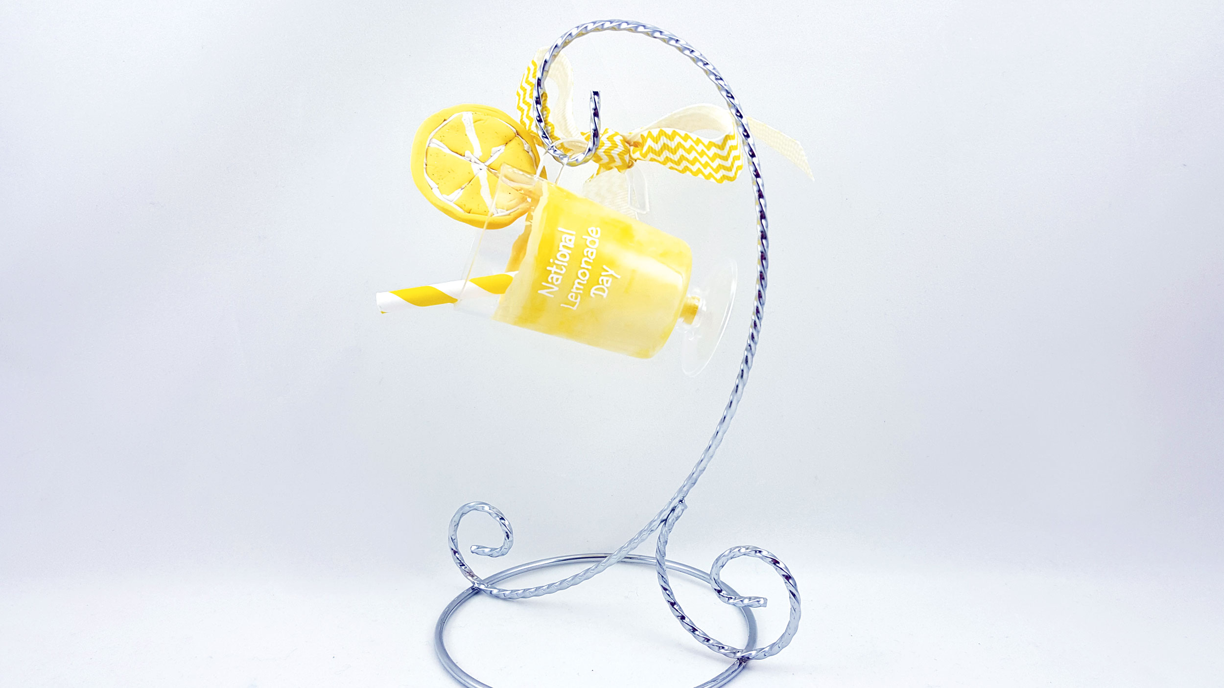 A final lemonade ornament hangs from it's very own ornament stand for display in a kitchen. | OrnamentShop.com