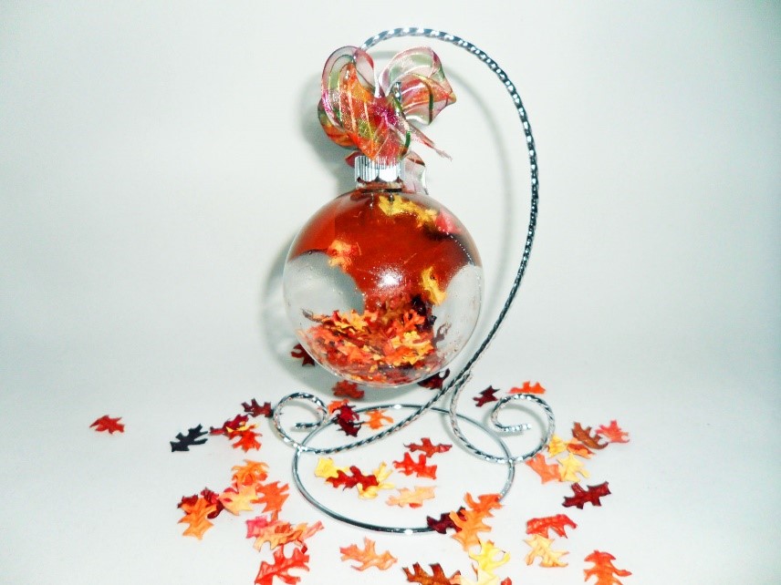 A fall glass ball ornament with autumn leaves. | OrnamentShop.com
