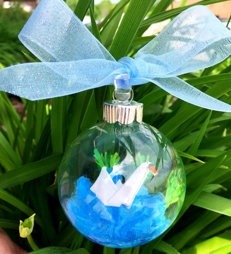 An origami swan inside of a glass ball ornament. | OrnamentShop.com