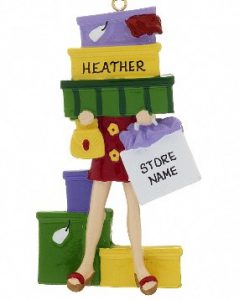 A woman holds a stack of shopping bags. | OrnamentShop.com