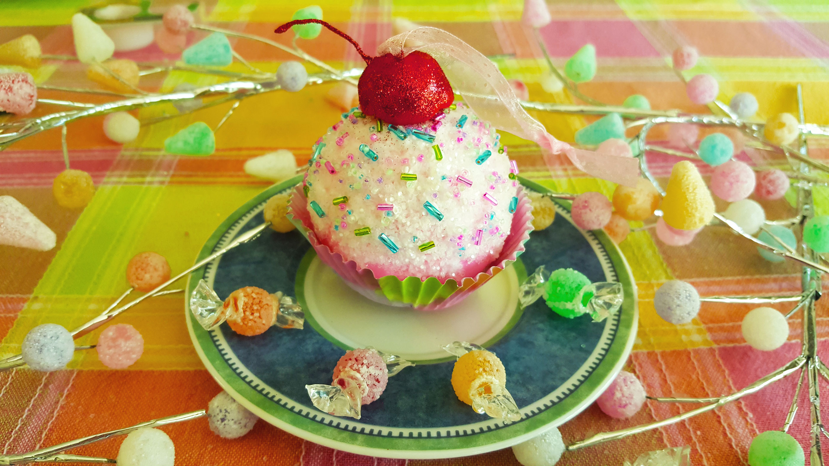 A finished pink cupcake DIY ornament with sprinkles and a cherry on top. | OrnamentShop.com