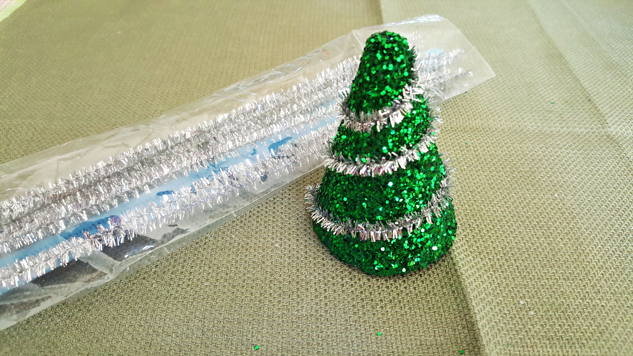 Step 3 is to decorate it with pipe cleaners and garland looping around like lights. | OrnamentShop.com
