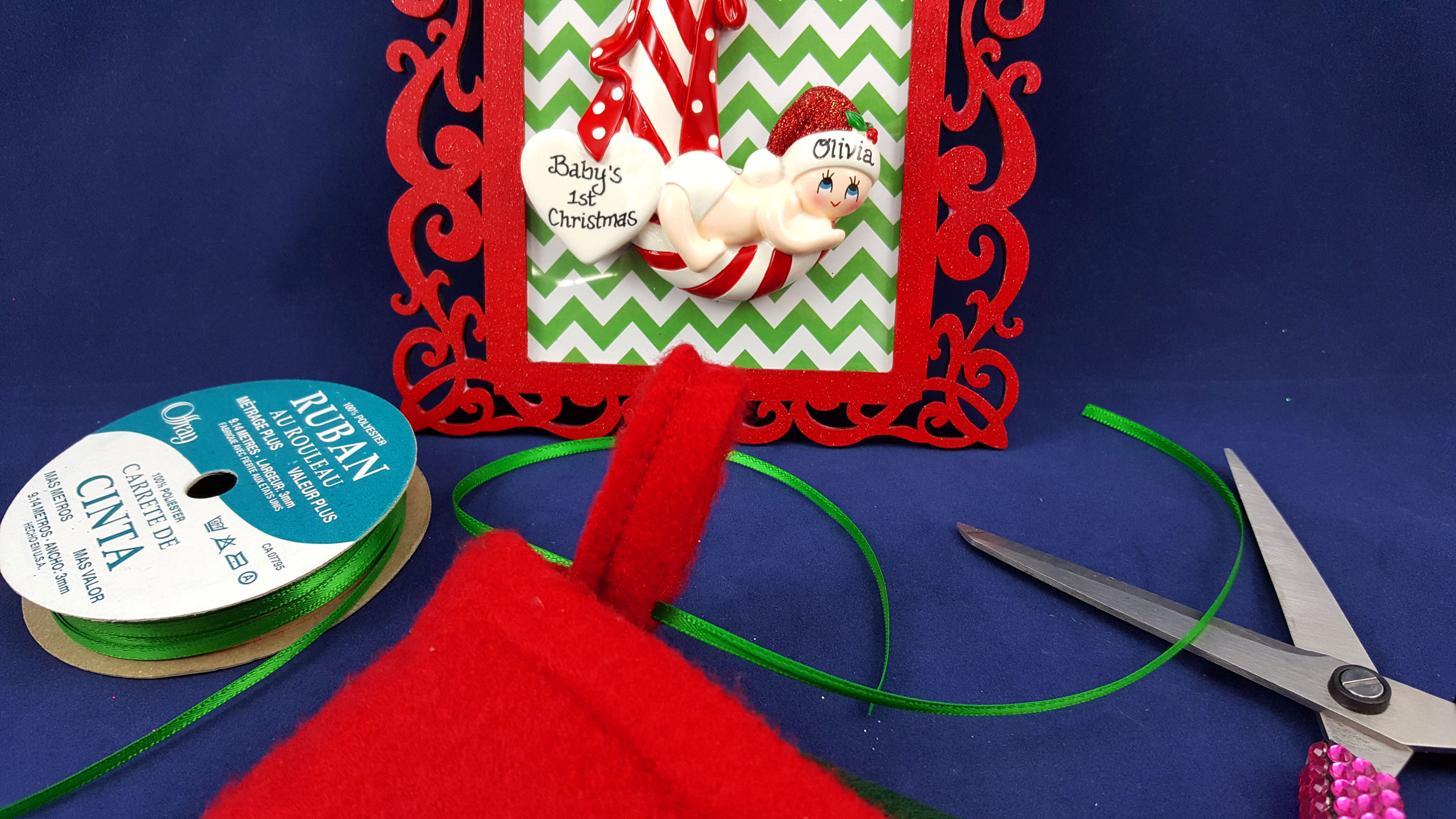 The final step is to add ribbon to the bottom to hang your stocking for a personalized Christmas stocking hanger in place of a fire place. | OrnamentShop.com