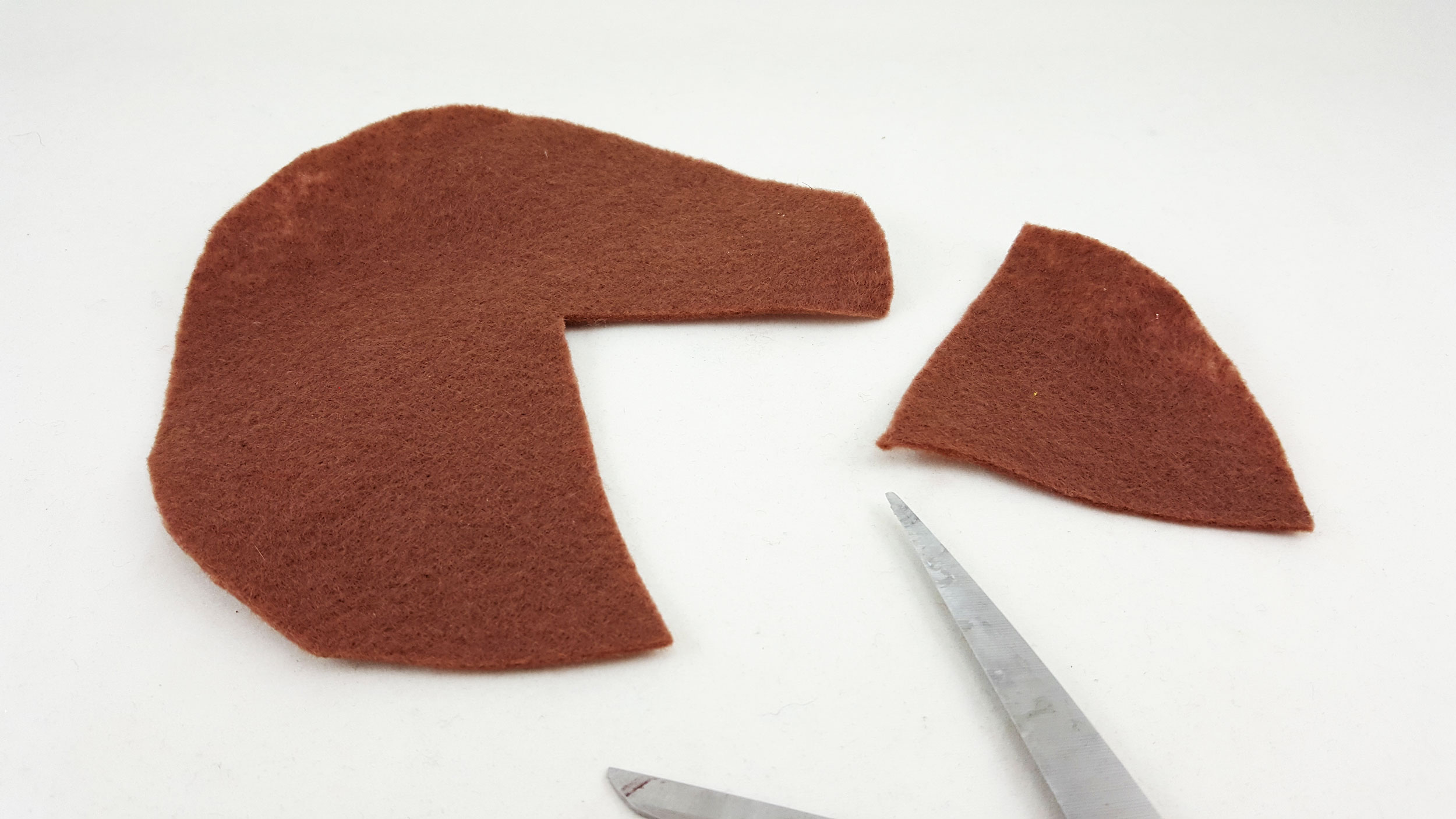 Step 3 is to cut a small pie wedge from the felt circle. | OrnamentShop.com