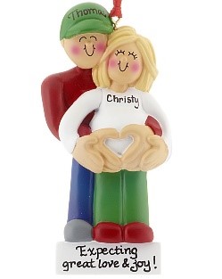 A man stands behind a wife on an ornament while holding her belly representing a pregnancy. | OrnamentShop.com