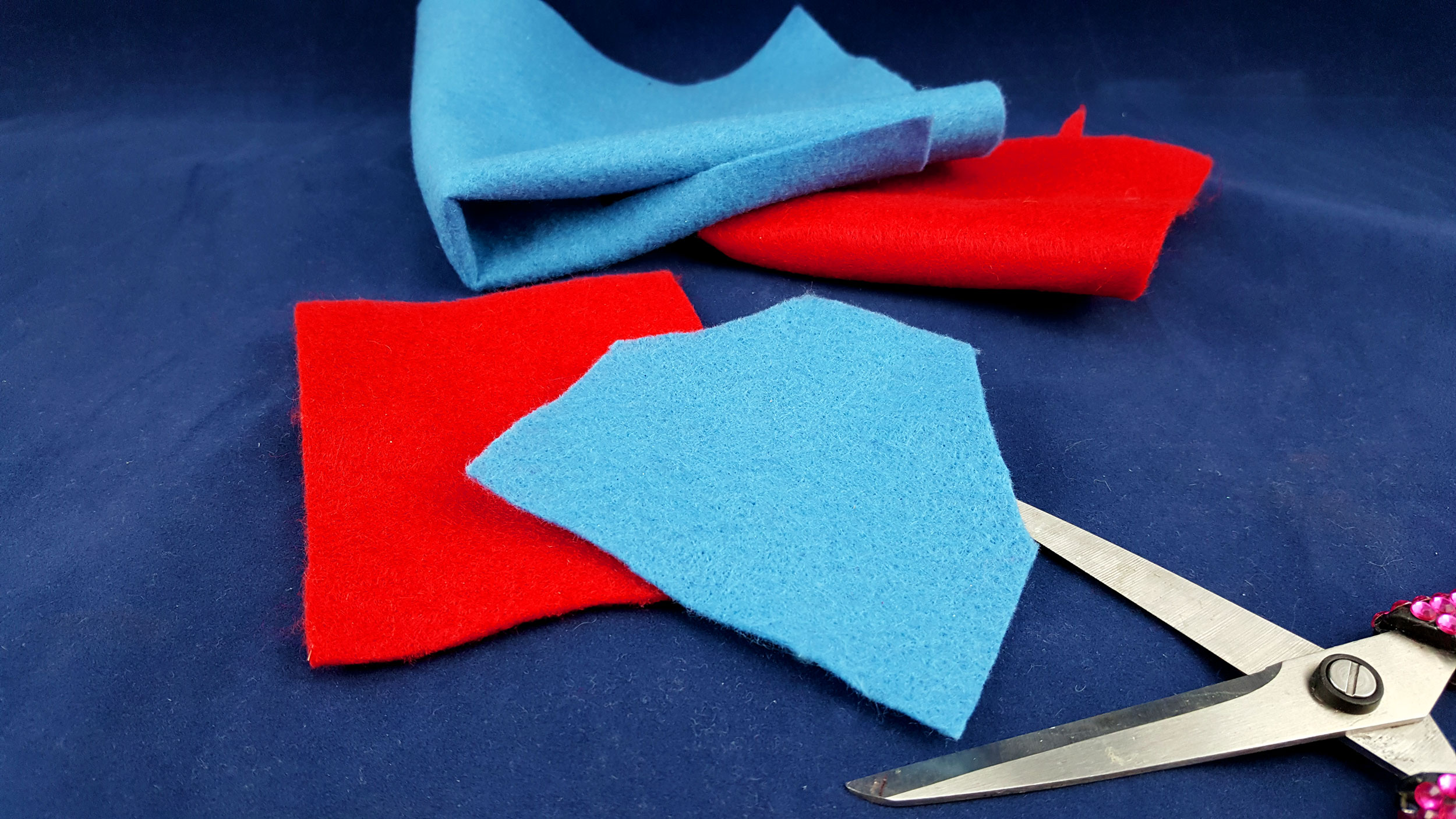 Cut a 3” square from each color of the felt. Then, trim the two top corners off. | OrnamentShop.com