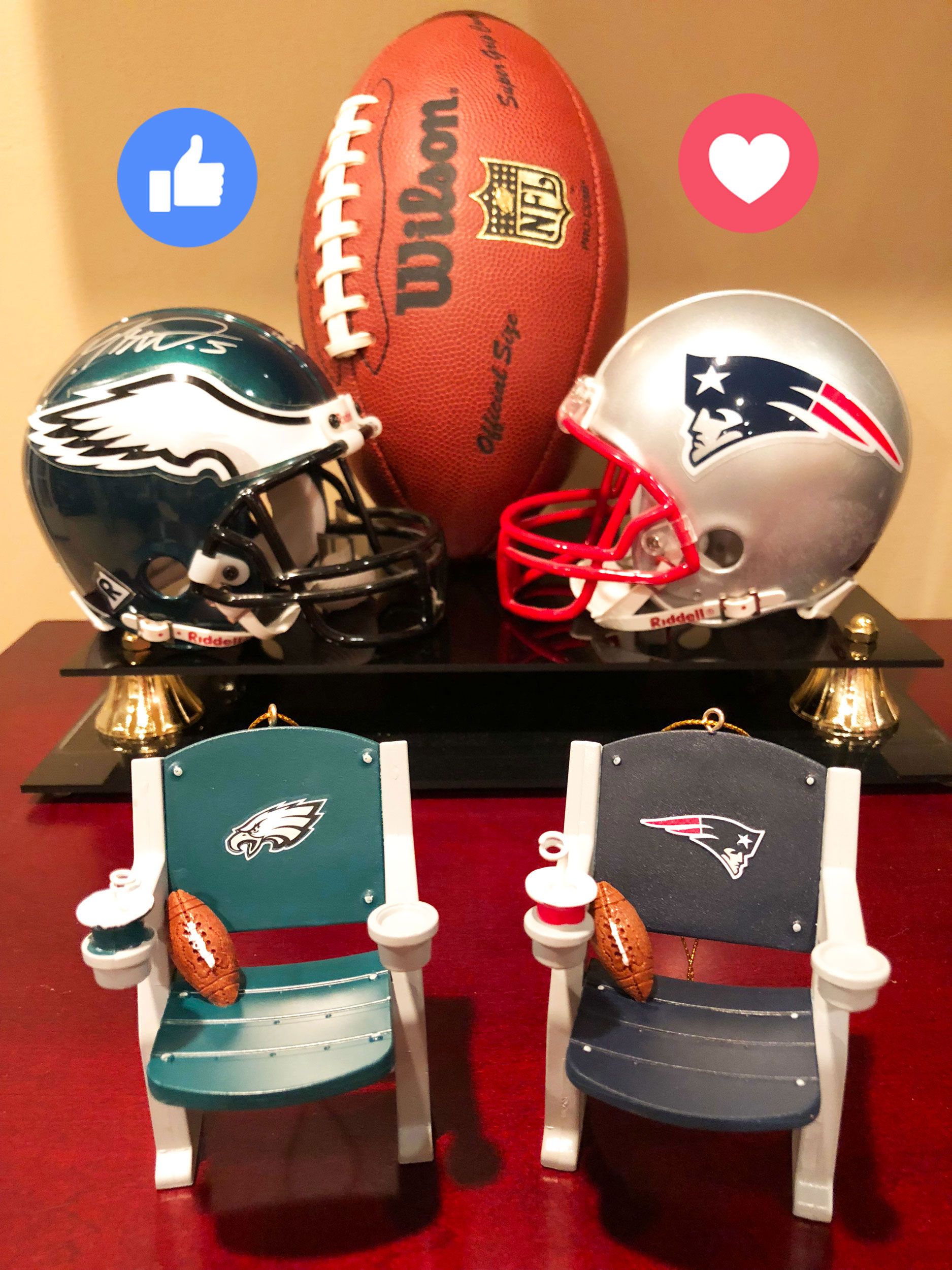 An Eagles helmet and Patriots helmet behind two ornaments for the Eagles and Patriots teams with stadium seats for each. | OrnamentShop.com