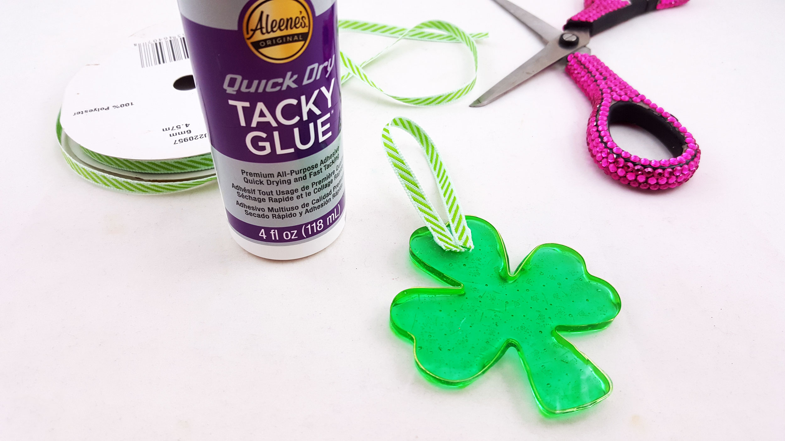 Step 3 is to let your clover ornament cool, pop it out of the cutter, and glue ribbon to the front and back. | OrnamentShop.com