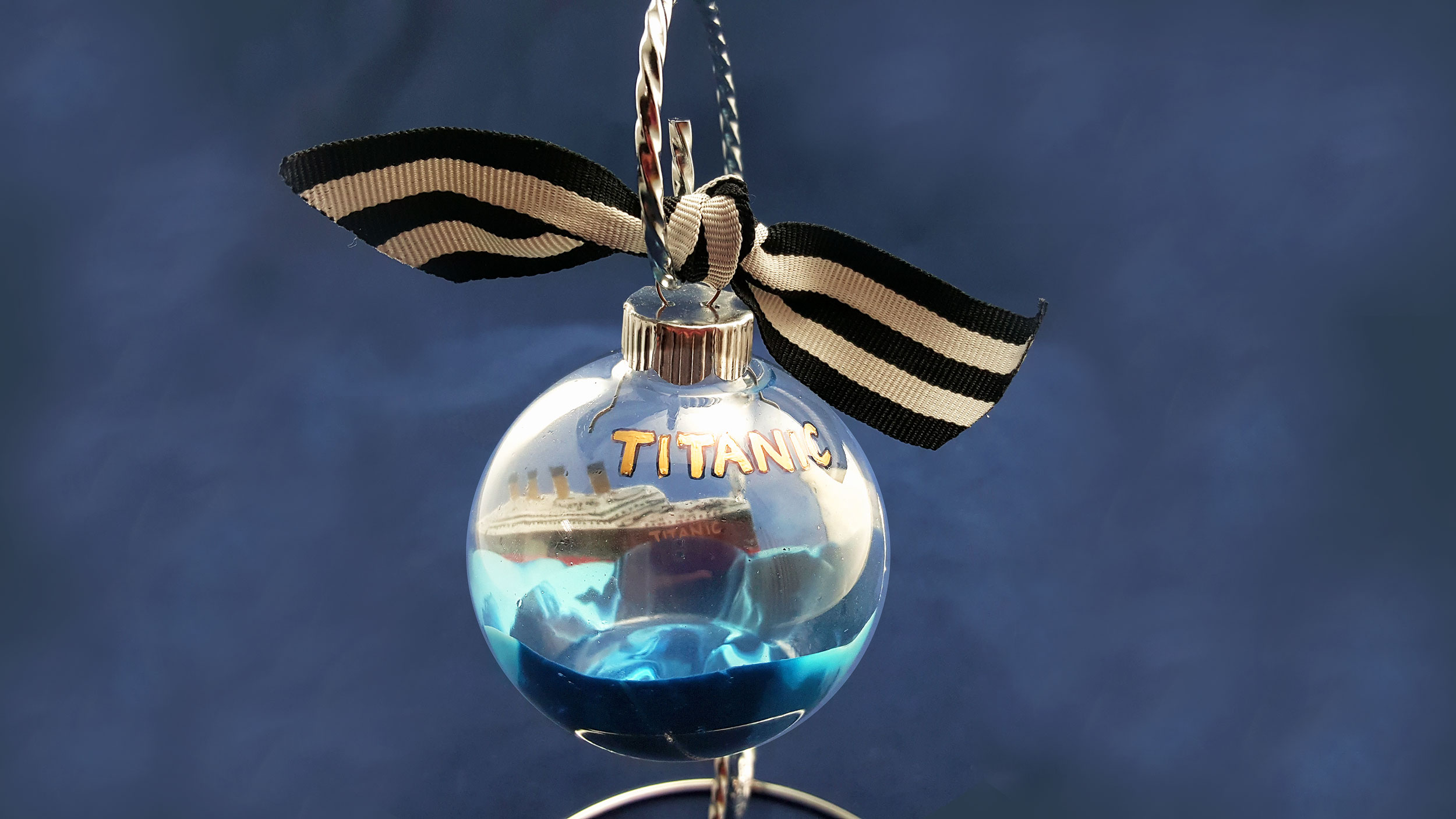 A completed DIY Titanic Ornament hanging from a hook. | OrnamentShop.com