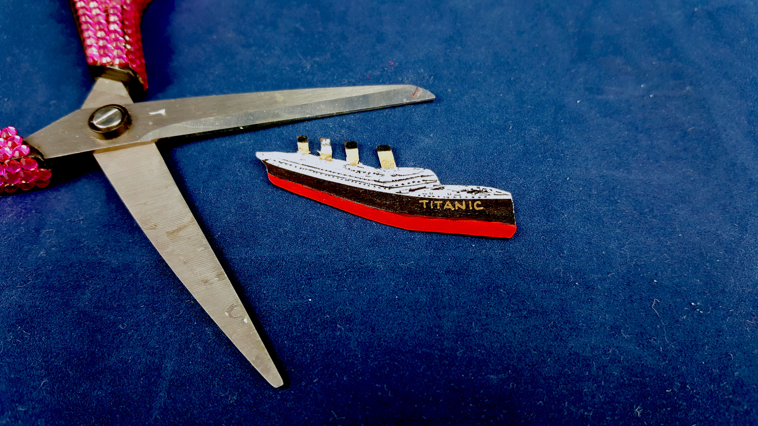 Step 1 is to find a picture of the titanic ship online, size it to the ornament and cut out with scissors. | OrnamentShop.com