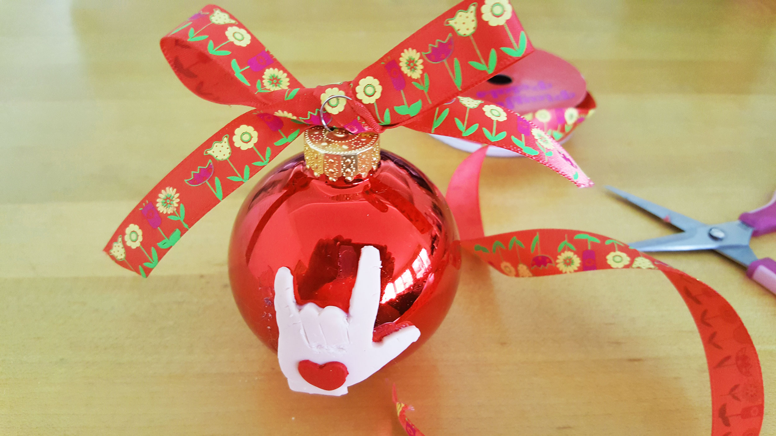 Ribbon tied on red glass ball ornament | OrnamentShop.com