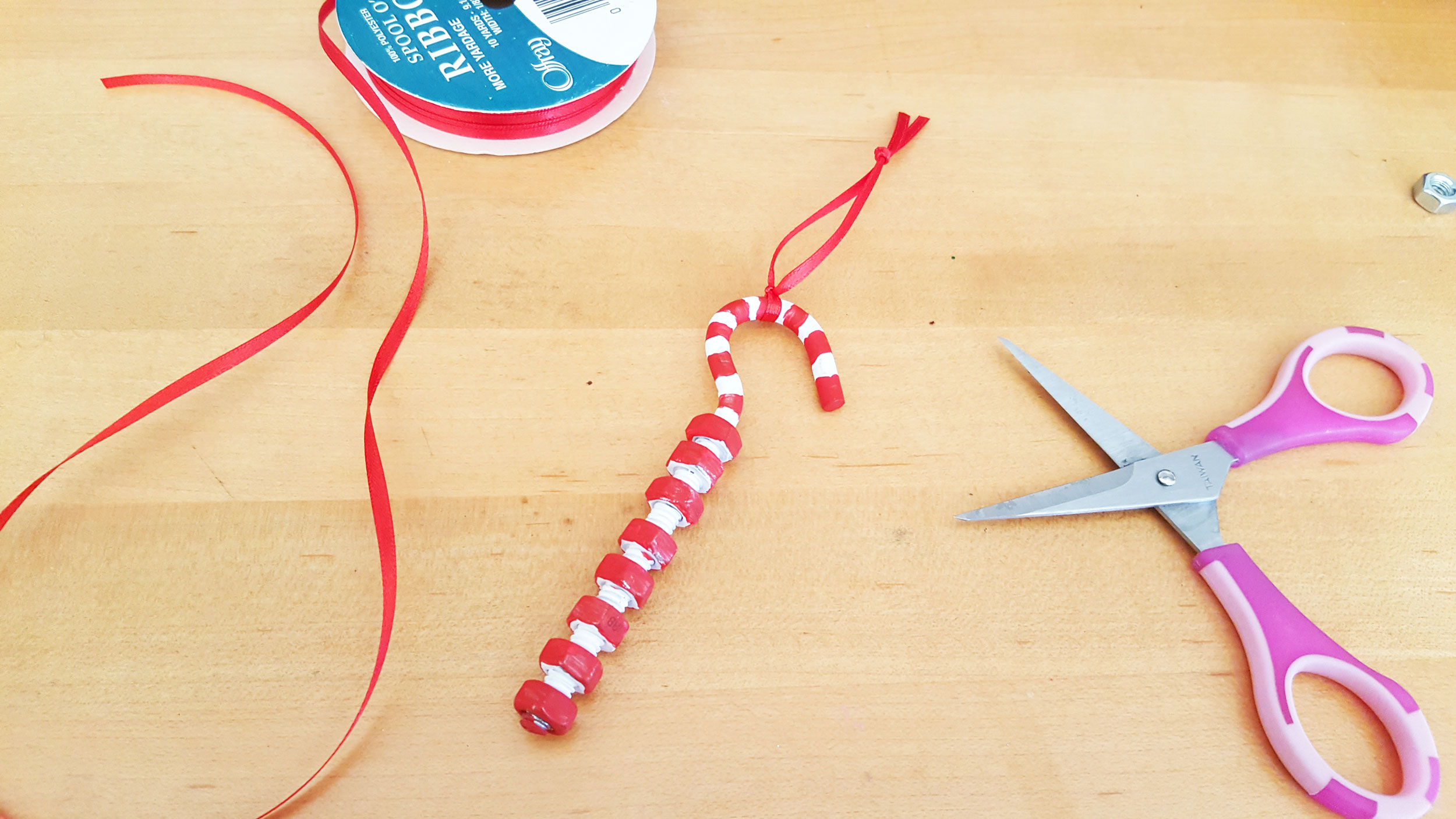 Father's Day candy cane Step 8 is to let the paint dry and tie the ribbon to the ornament for hanging. | OrnamentShop.com