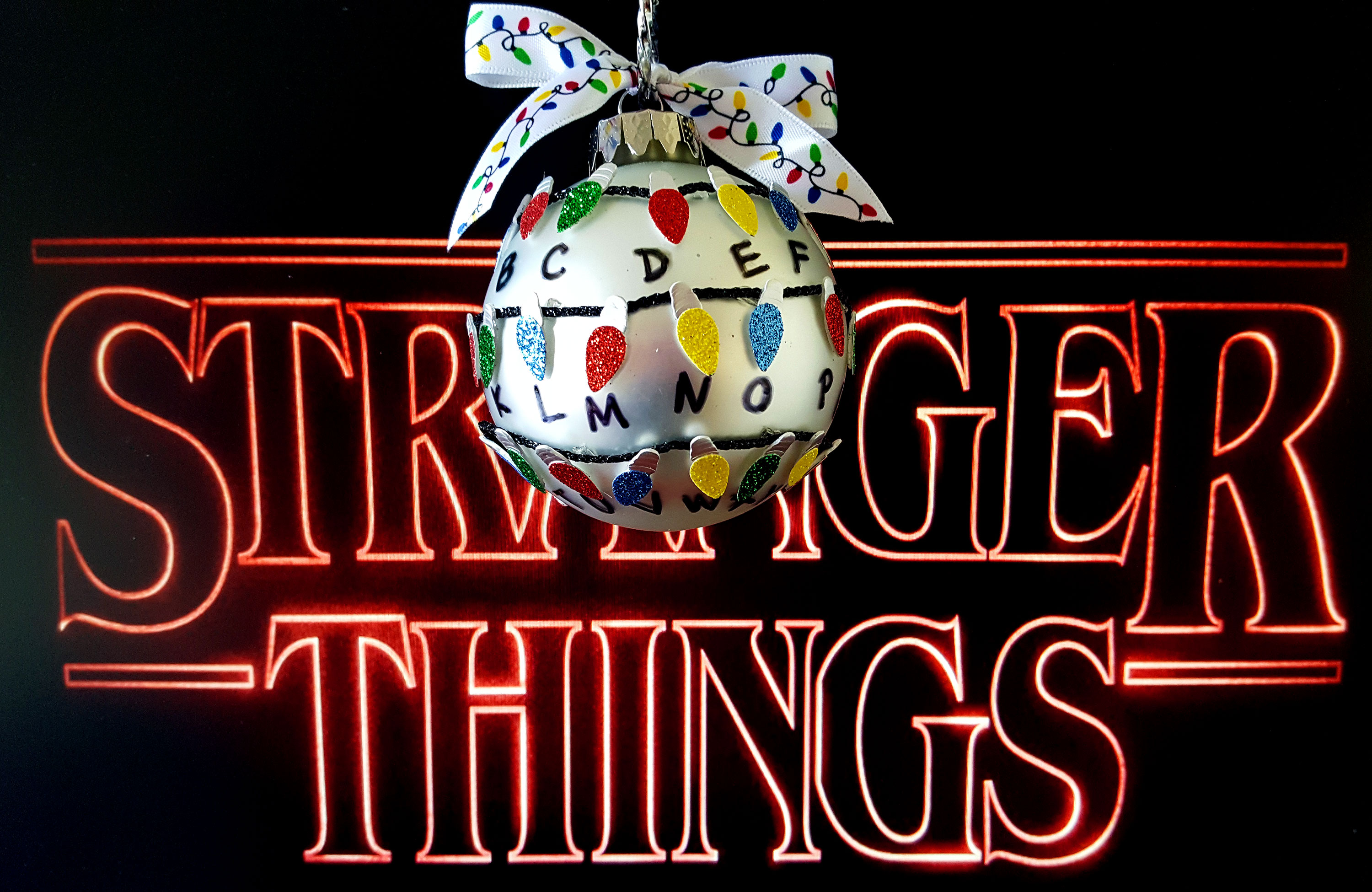 Stranger Things DIY Ornament made with black string, light stickers, marker and a glass ball. | OrnamentShop.com