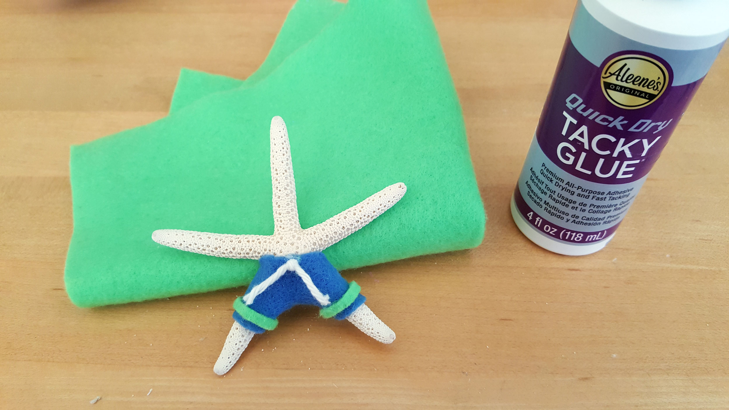 Cut-out felt glue on top of starfish and cotton balls by tacky glue. | OrnamentShop.com