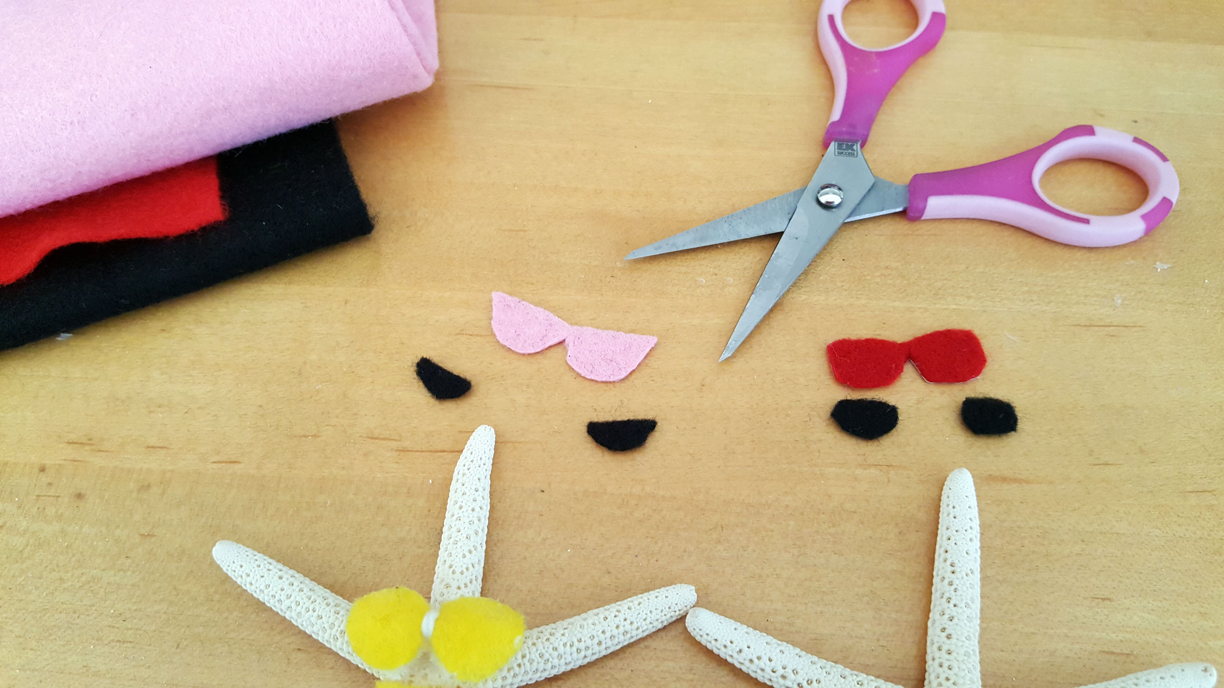 Cut-out felt in shape of sunglasses with sewing scissors. | OrnamentShop.com