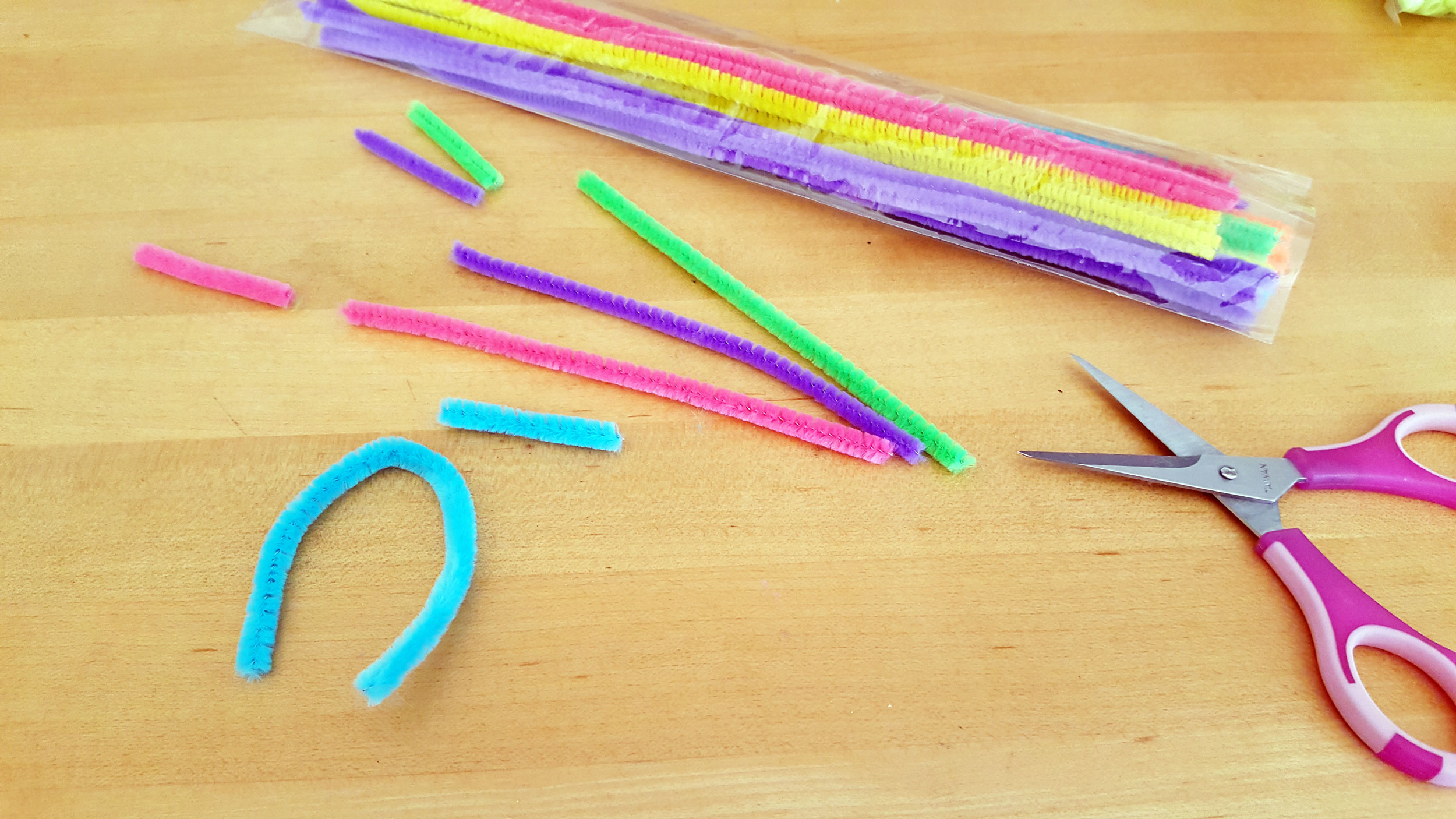 Colorful pipe cleaners cut into various sizes with scissors. | OrnamentShop.com