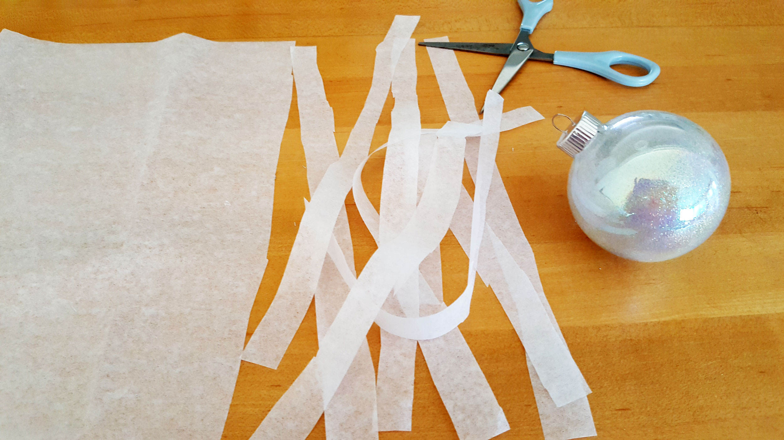 Tissue paper cut into strands with scissors. | OrnamentShop.com