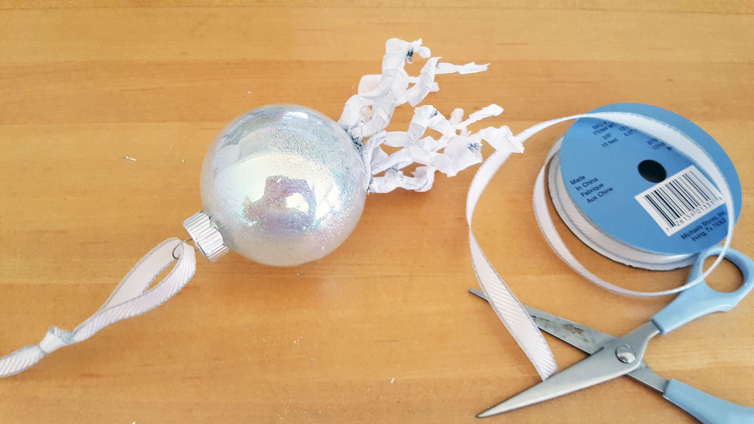 Ribbon added to top of glass ball ornament. | OrnamentShop.com