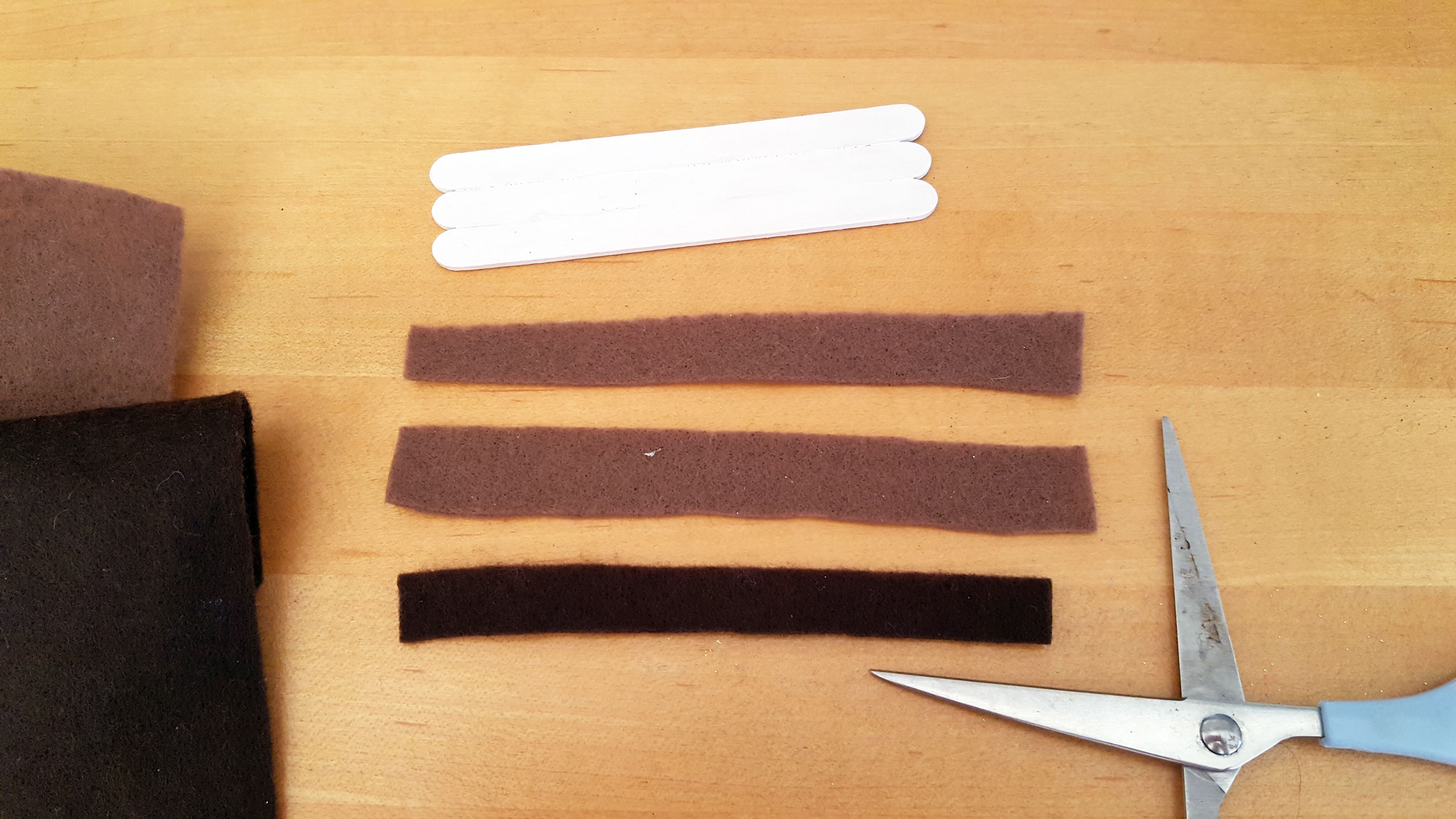 Step 3 is to cut two rectangular brown felt strips for the graham cracker and one from dark brown felt for chocolate. | OrnamentShop.com