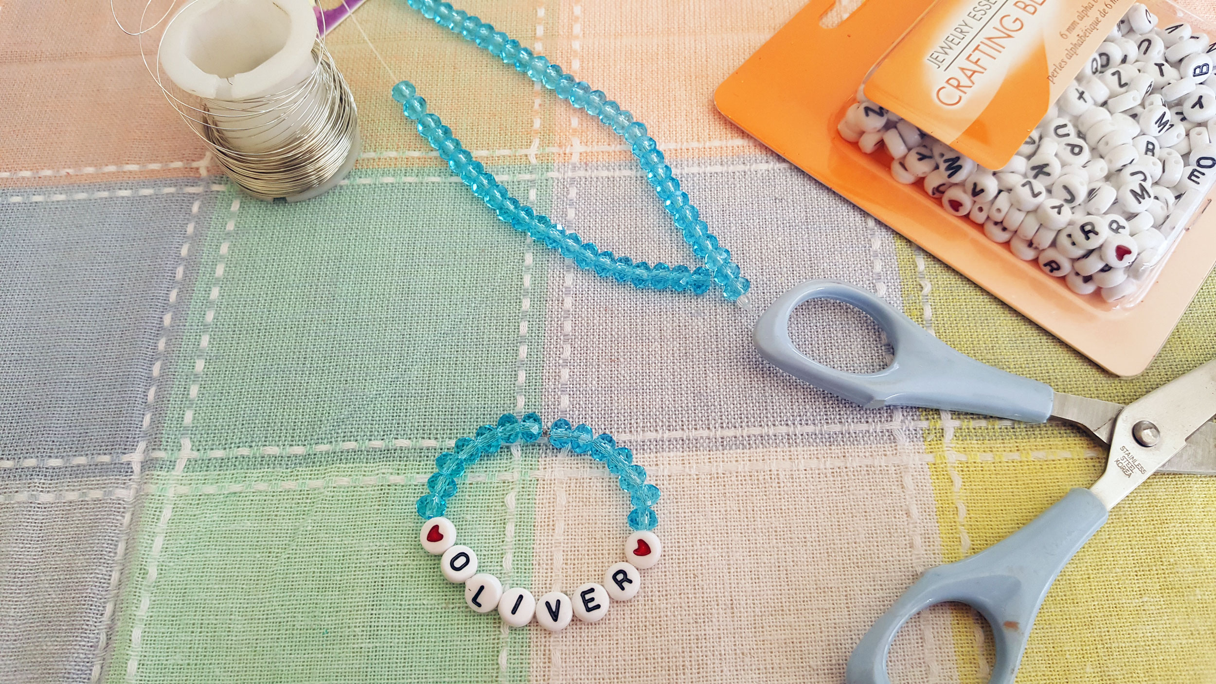 Bead bracelet with newborn's name in beads. | OrnamentShop.com