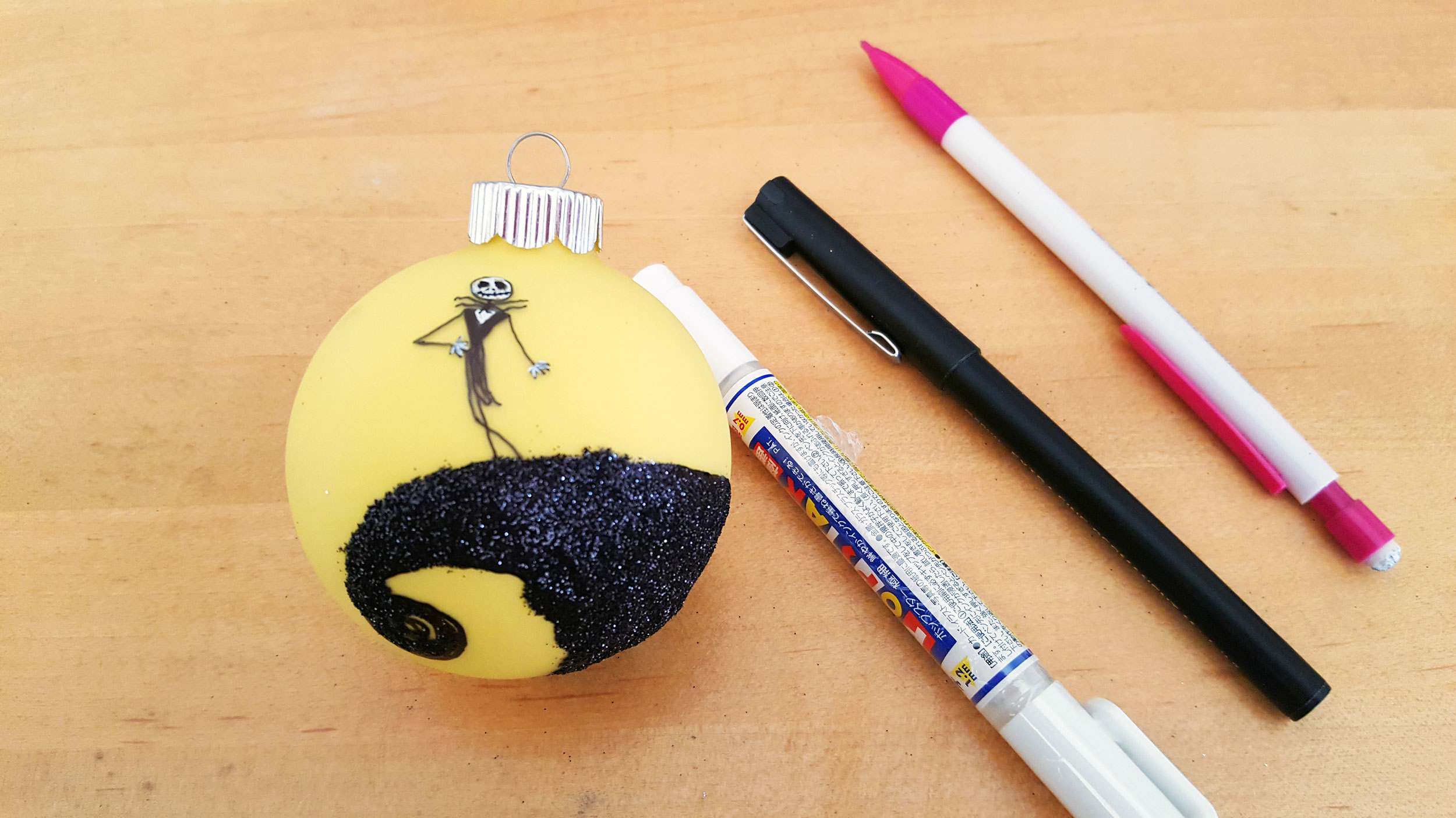 Nightmare Before Christmas Ornaments use markers to draw Jack Skellington standing on the ledge | OrnamentShop.com