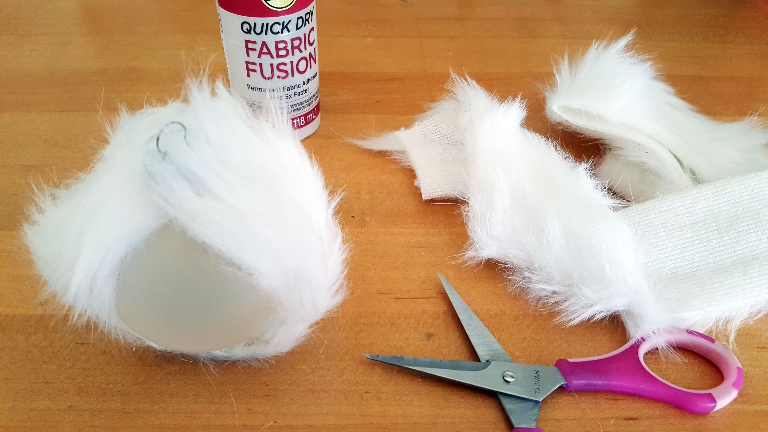 Smallfoot DIY Step 1 is to cut and glue a faux fur strip around the longitude of the ornament. | OrnamentShop.com
