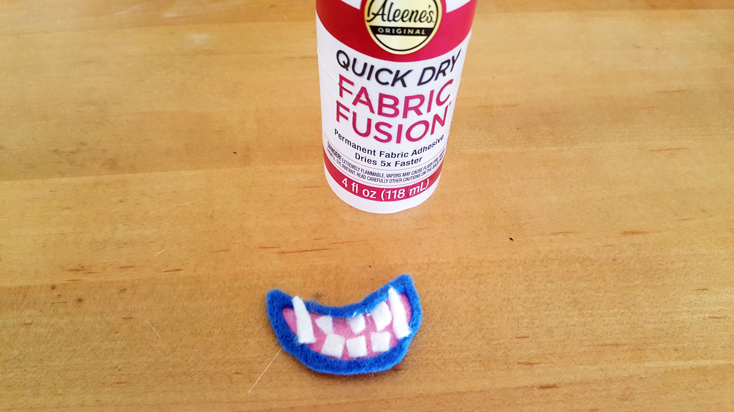 Smallfoot DIY Step 10 is to glue the teeth in place. | OrnamentShop.com