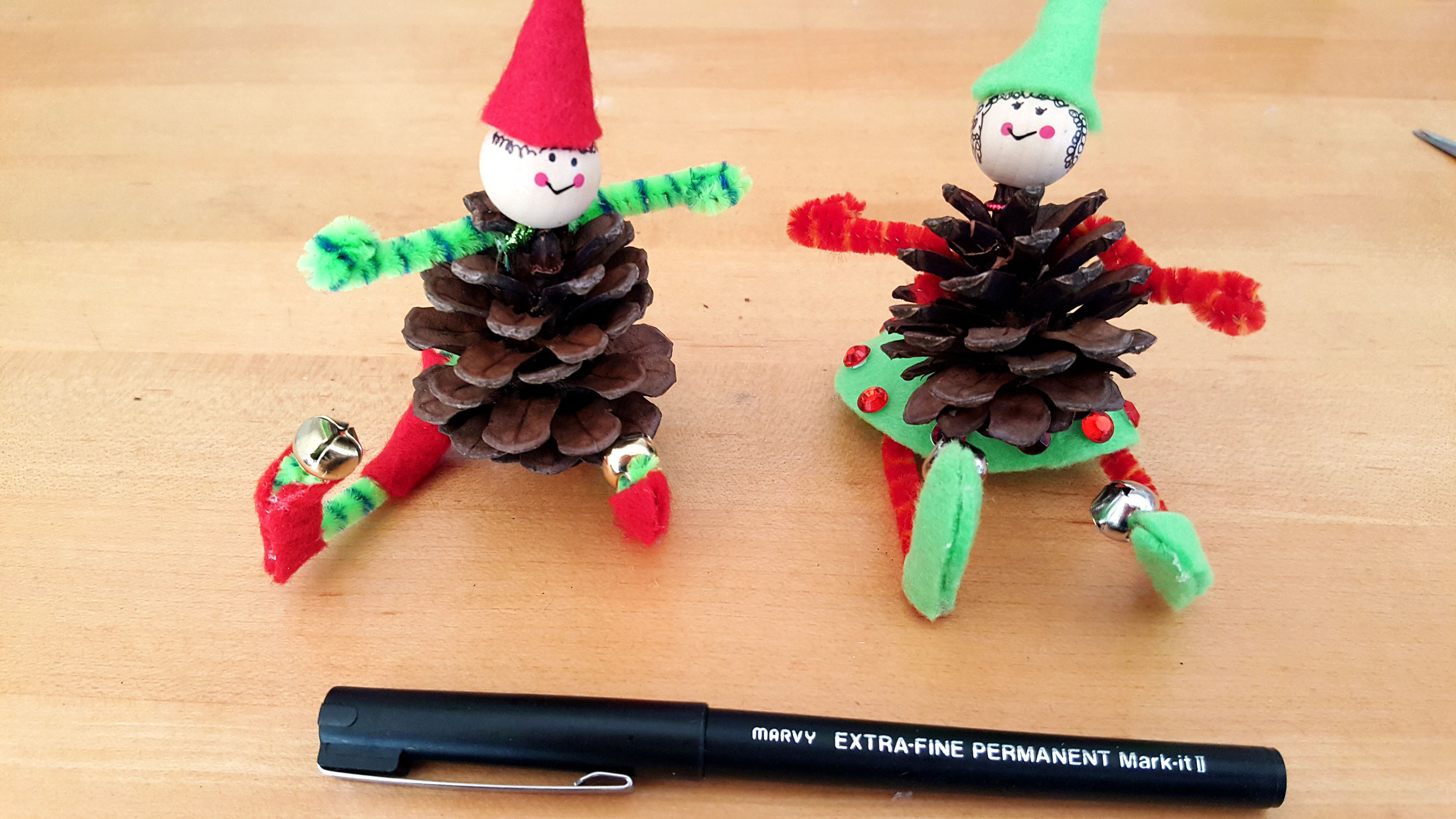 Pine Cone Elf Ornaments Step 9: Use a marker to draw a bit of hair sticking out from underneath the hat. | OrnamentShop.com