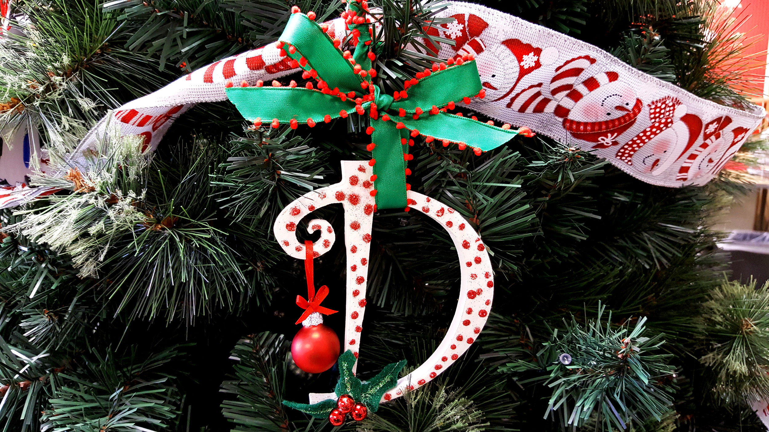 Completed Initial Ornament hanging on a tree. | OrnamentShop.com