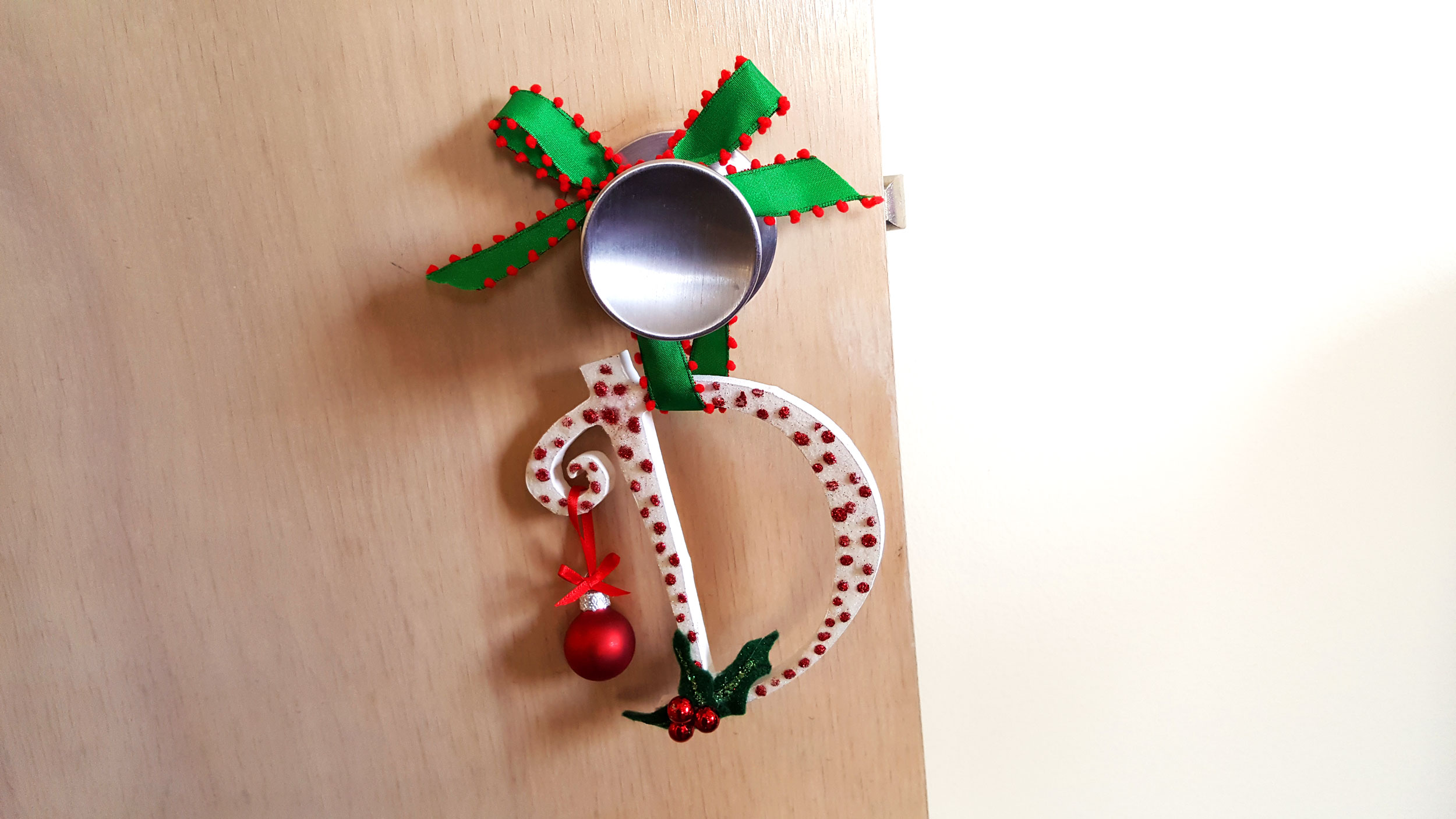 Initial Ornaments hanging on a doorknob. | OrnamentShop.com