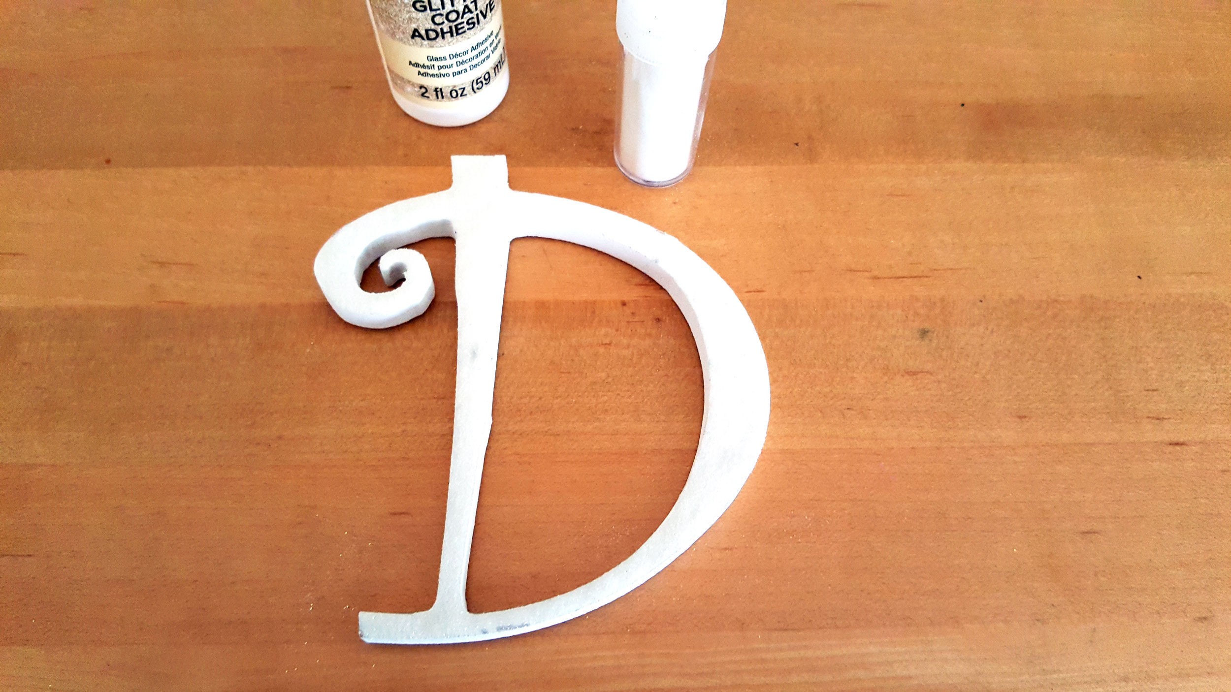 Initial Ornaments Step 1: Paint initial and coat in glitter. | OrnamentShop.com