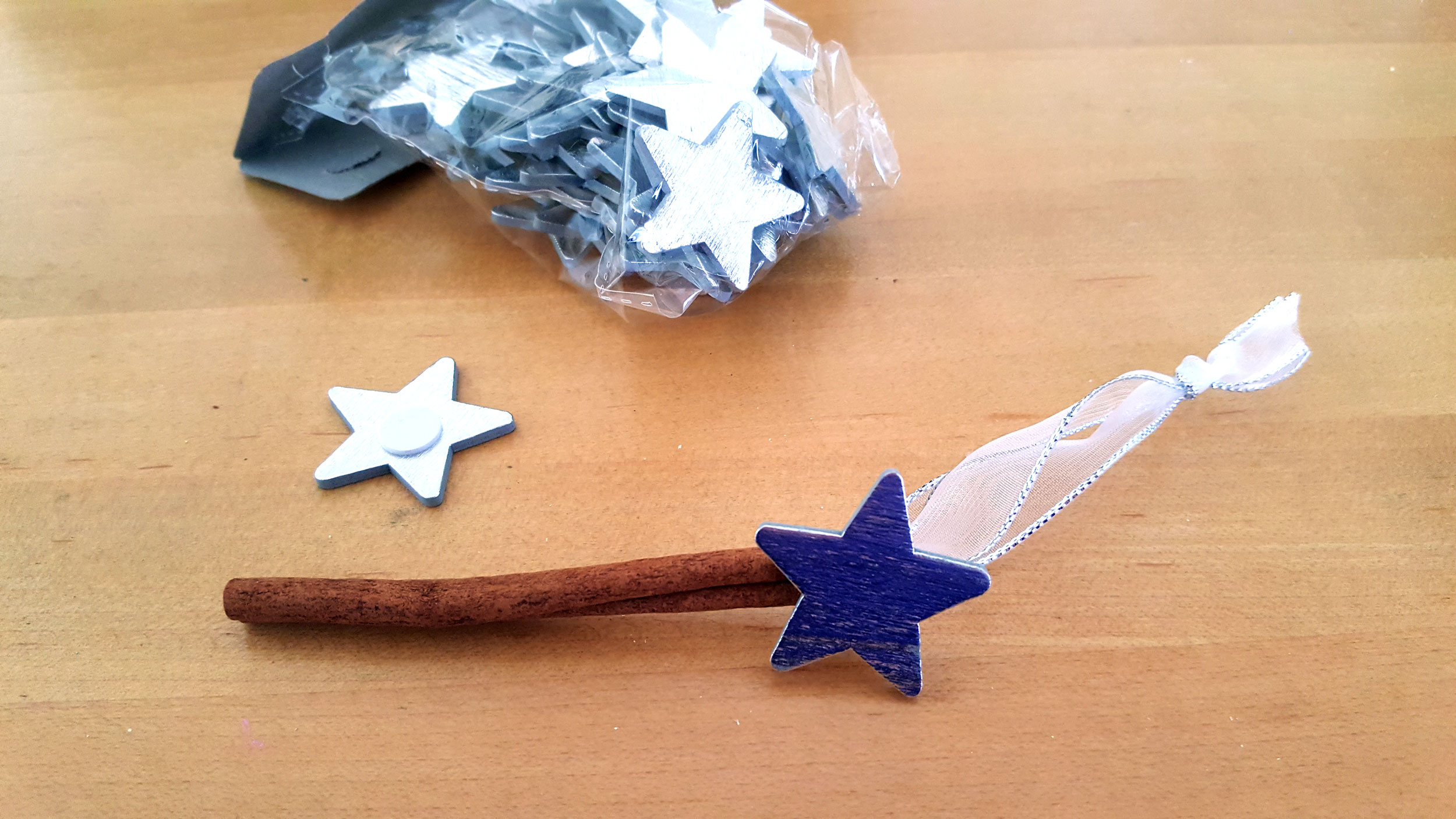 Ribbon tree ornament glue on a star towards the end of stick. | OrnamentShop.com