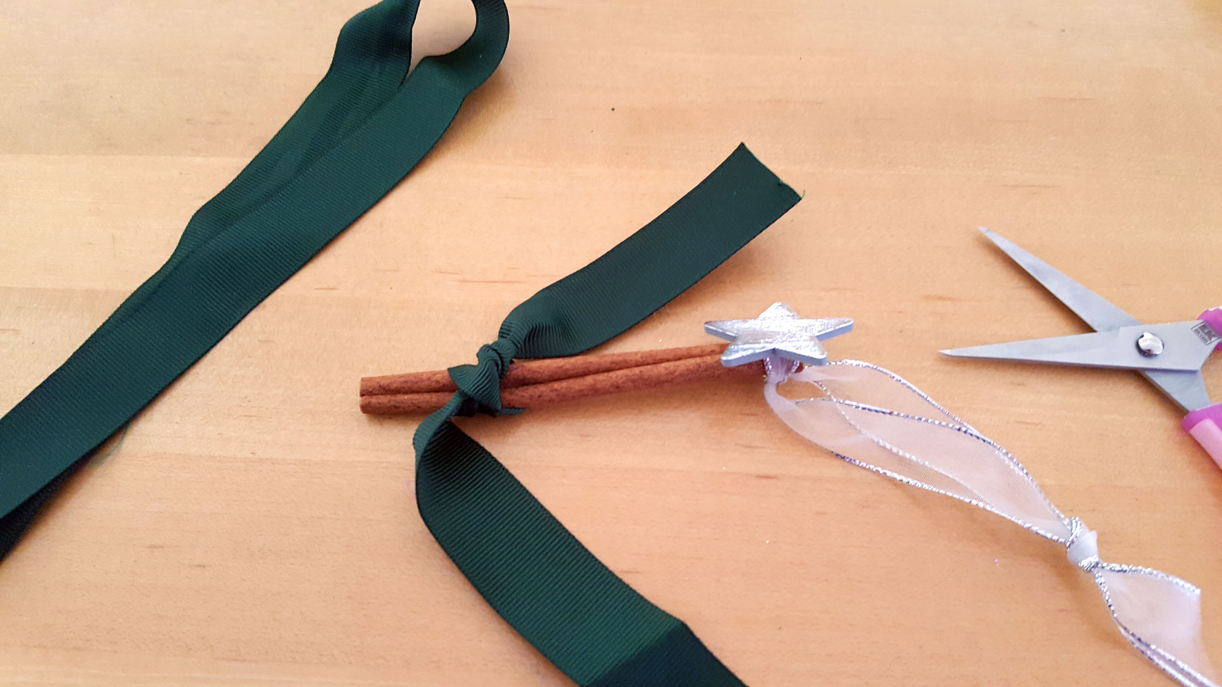 Ribbon tree ornament start tying ribbons towards end of stick. | OrnamentShop.com