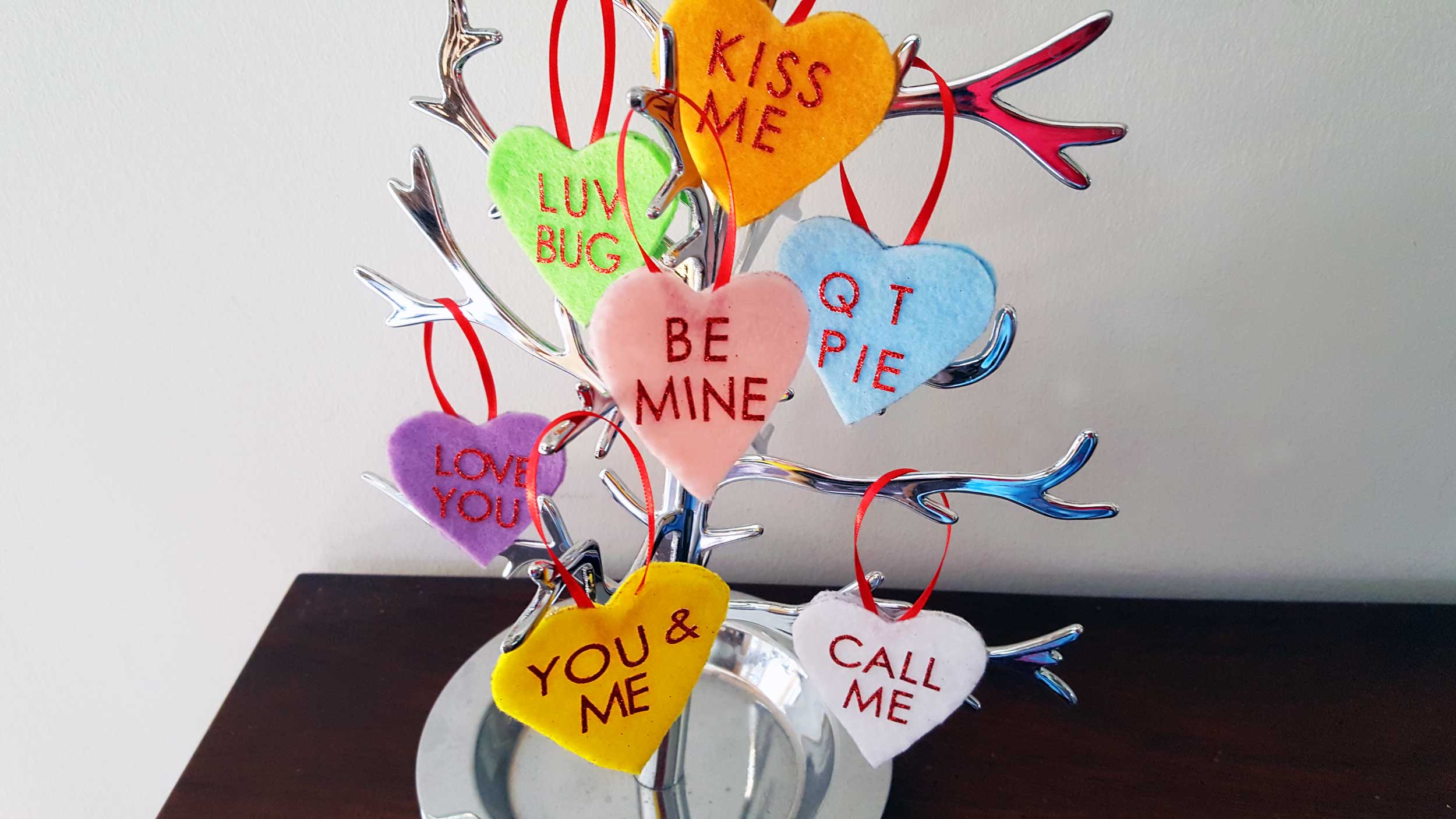 Valentine's Day ornaments on a jewelry tree with Conversation Hearts. Adorable DIY gifts! | OrnamentShop.com