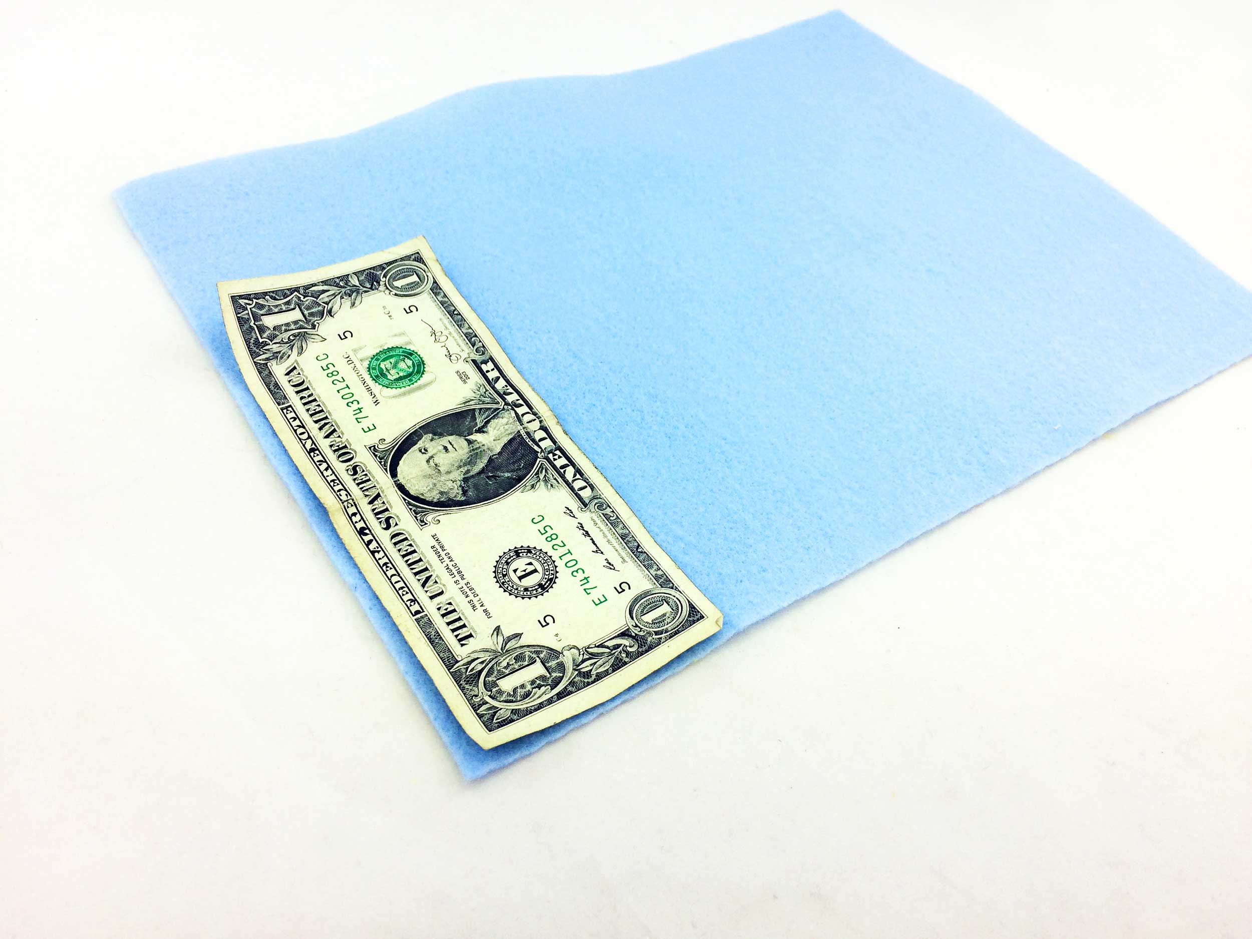 Dollar bill on felt ready to be traced. | OrnamentShop.com