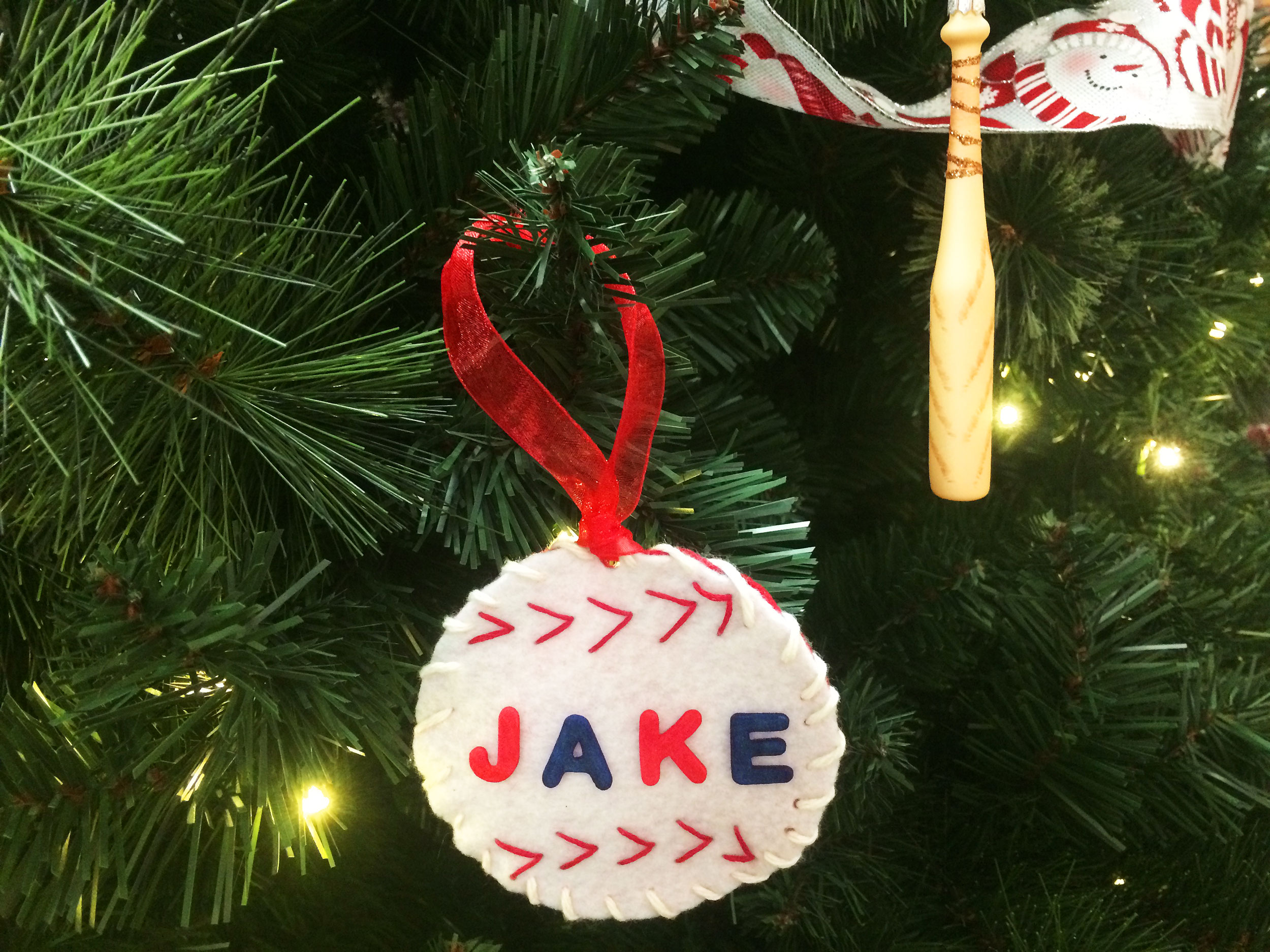 Finished DIY baseball ornament hanging on Christmas tree. | OrnamentShop.com