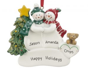 An ornament for couples with two snowmen side by side holding hands and a tan dog at their side. | OrnamentShop.com