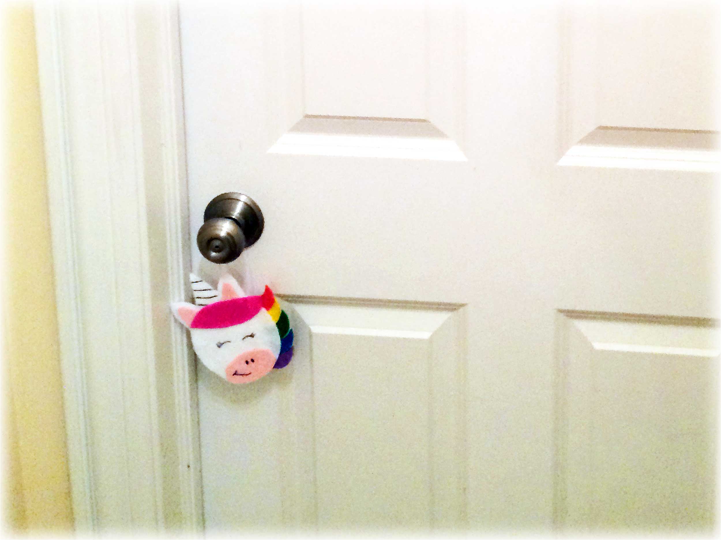 Unicorn ornament hanging from bedroom door | Ornament Shop