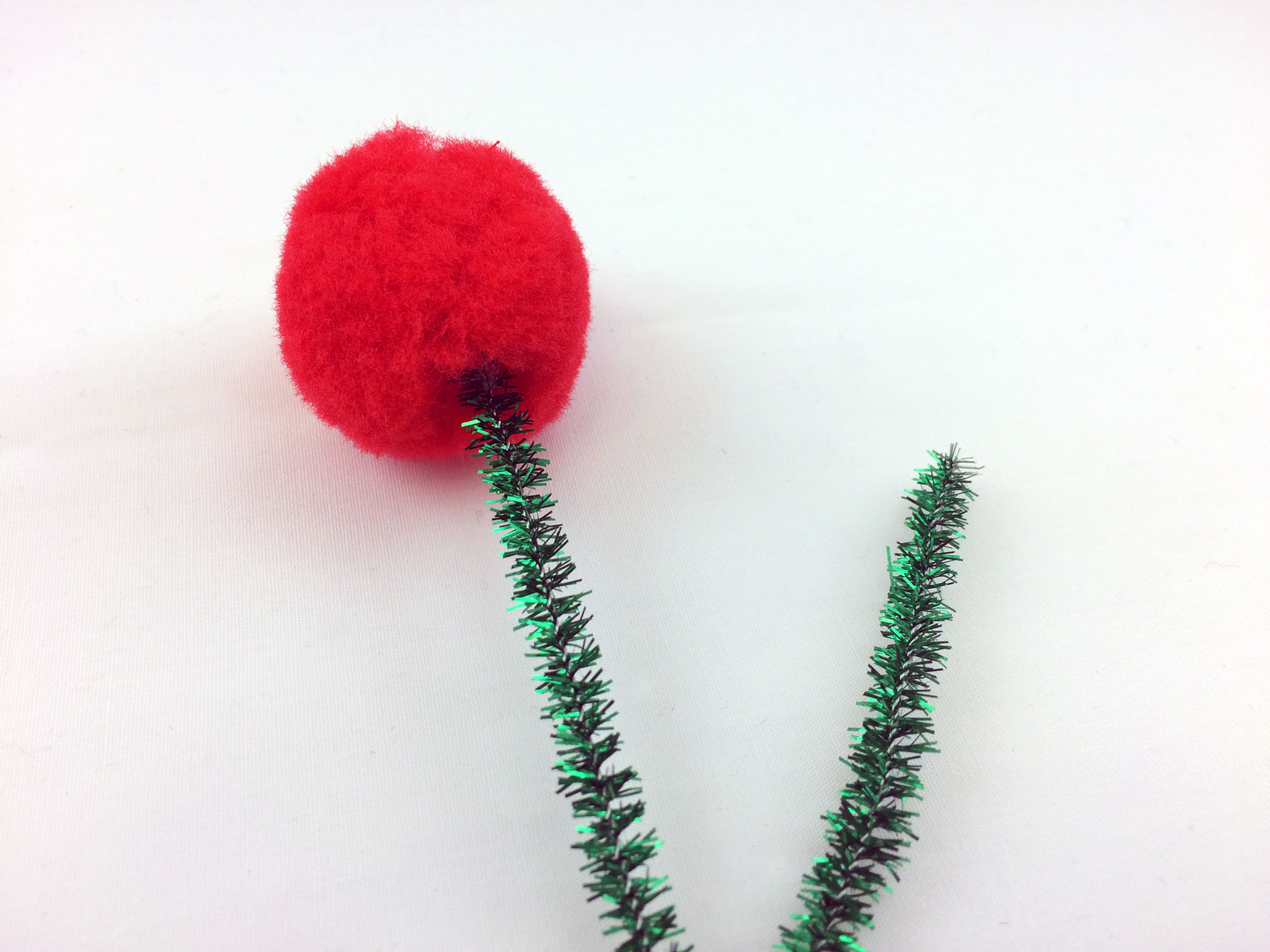 Secure red pom pom to glued stem | Ornament Shop