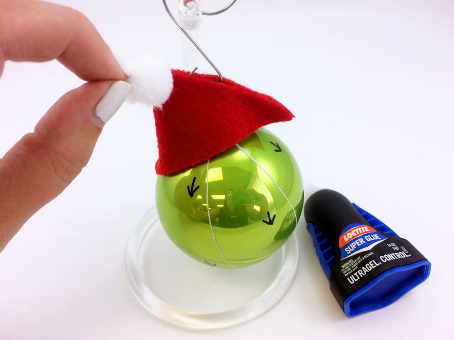 Glue white pom pom to santa hat | OrnamentShop.com